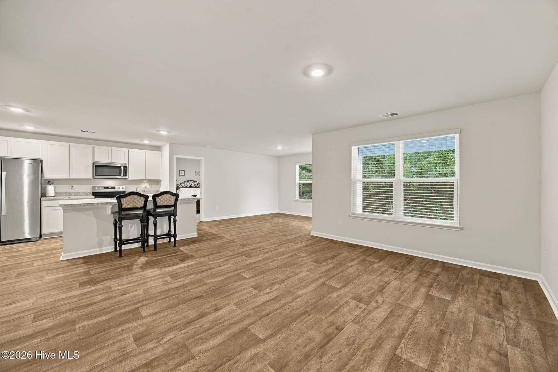 Living room looking into kitchen. Dining area in the back. - 2991 Hardsmith Street, Shallotte, NC 28470