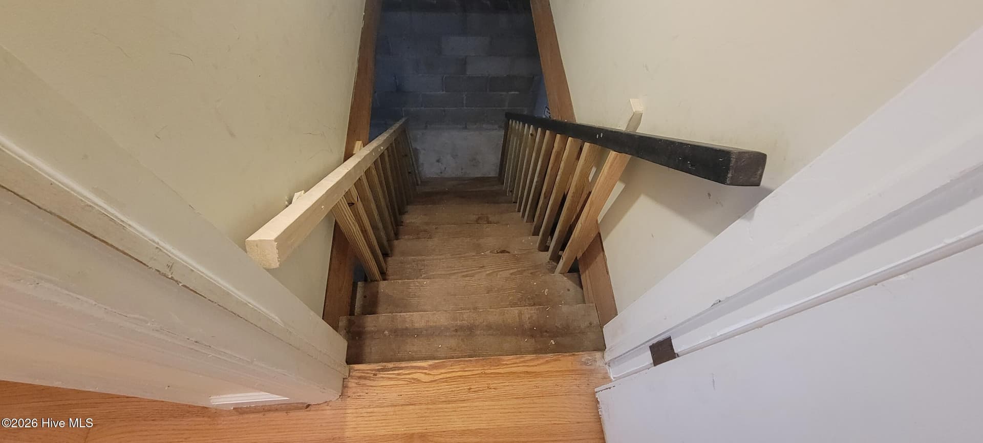 New basement handrails and spindles leading from the interior hallway - 110 Landon Drive, Washington, NC 27889