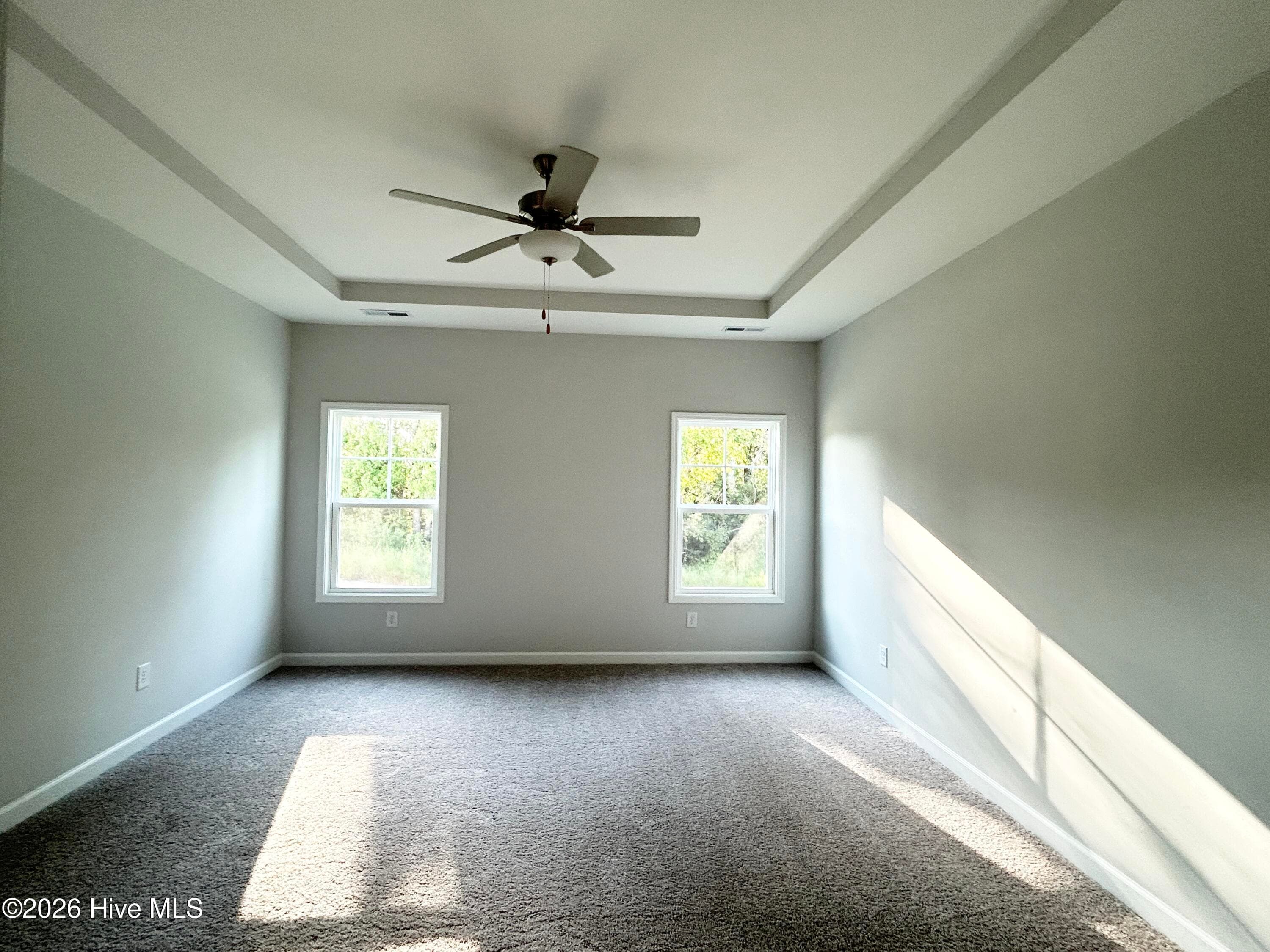 Primary Suite features a Private Bathroom with Tile Shower and Large Walk-in Closet - 4153 Workman Loop 68, Leland, NC 28451