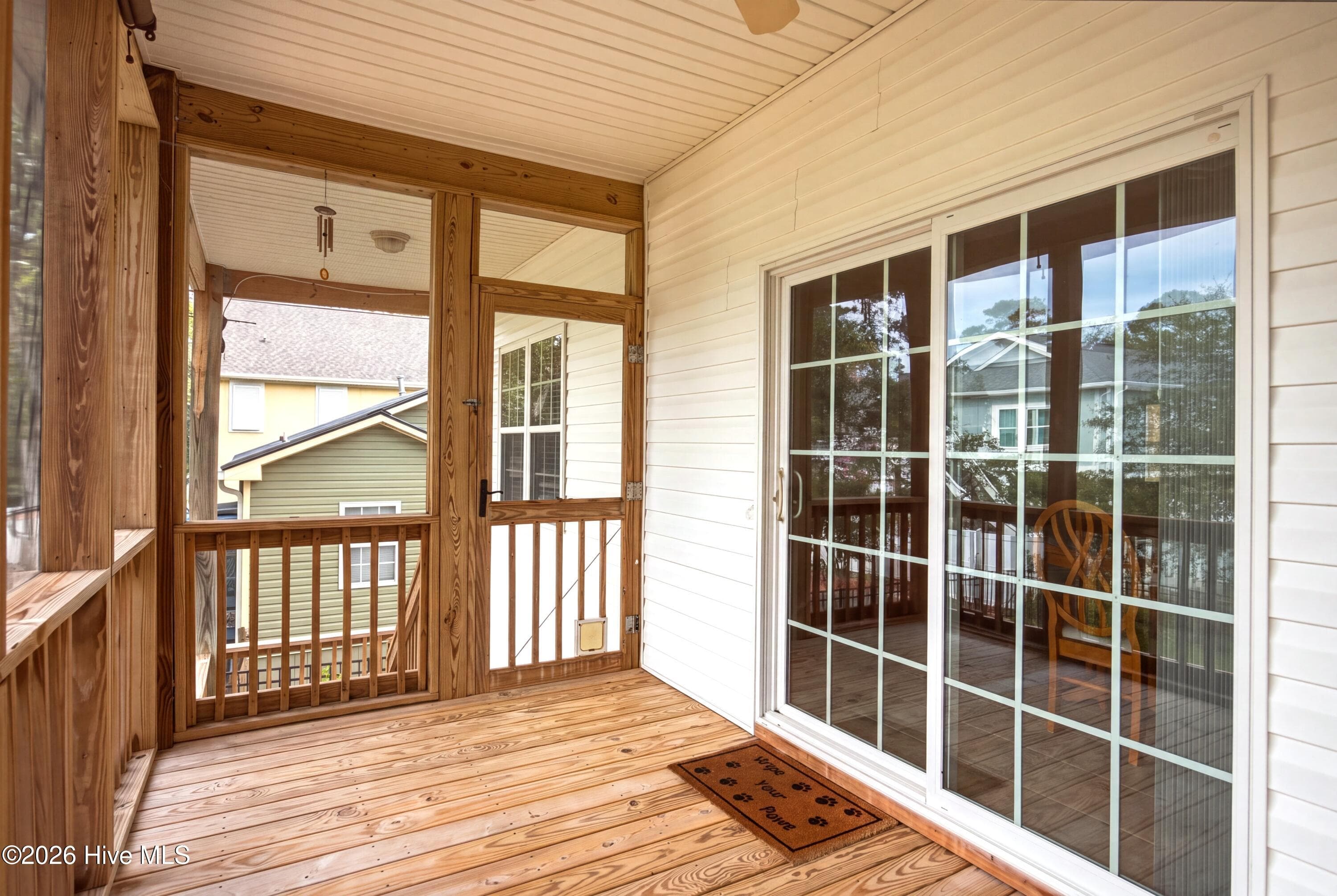 SCREENED BACK PORCH overlooking Back Yard - 225 NE 39th Street, Oak Island, NC 28465