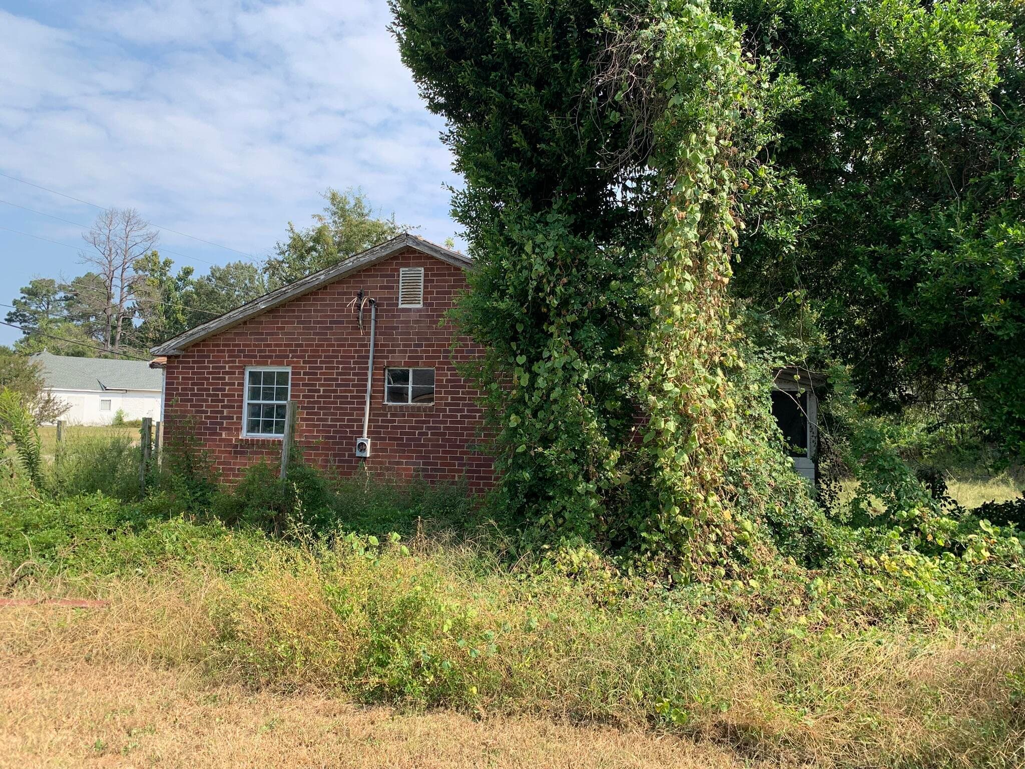 Side view of old house. - 1151 Sand Bar Ferry Road, Beech Island, SC 29842