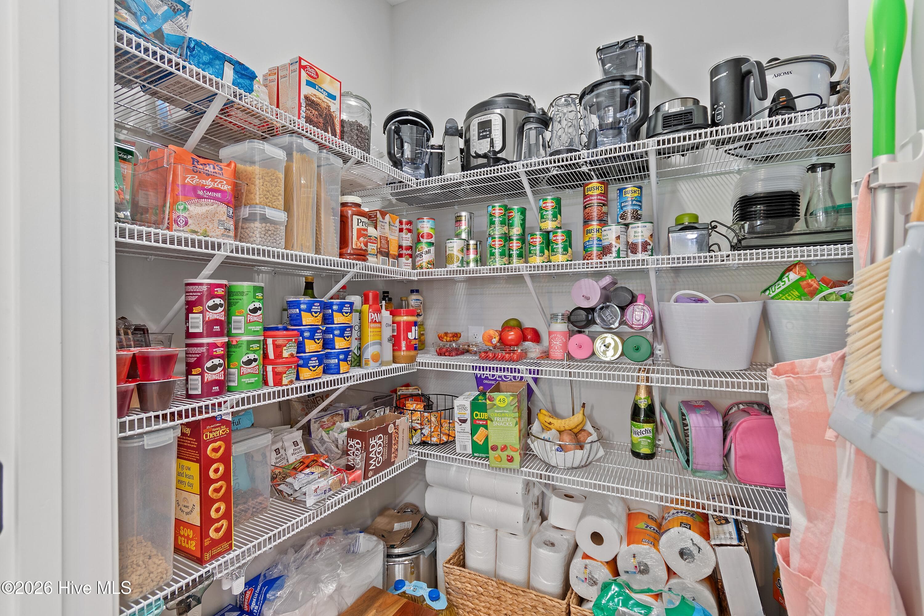 This spacious pantry helps keep the kitchen organized, functional, and clutter-free. - 299 Boundaryline Drive NW, Calabash, NC 28467