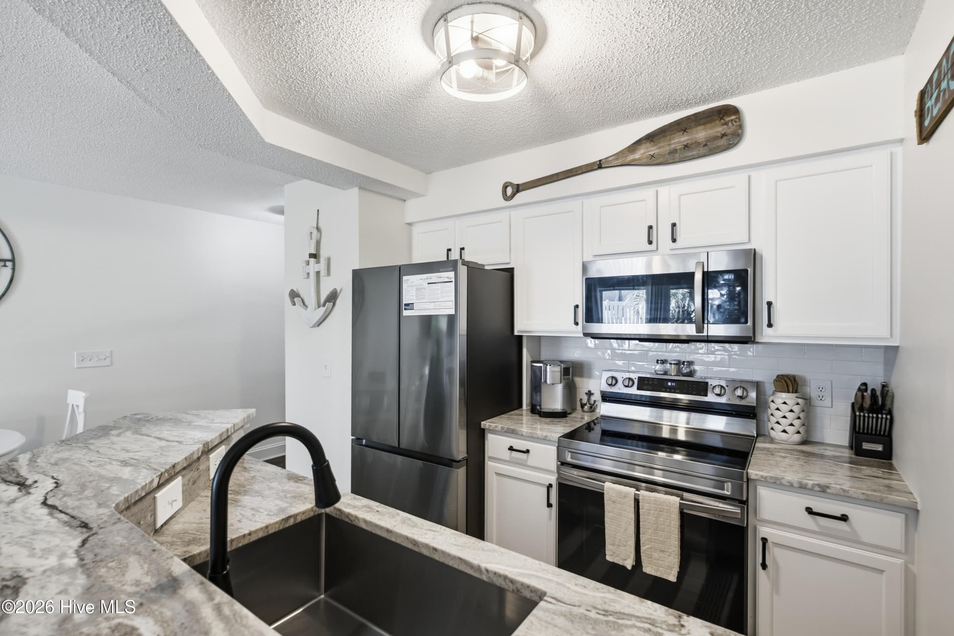 Fully furnished Kitchen/Dining with updated appliances and granite - 908 Resort Circle Unit 203, Sunset Beach, NC 28468