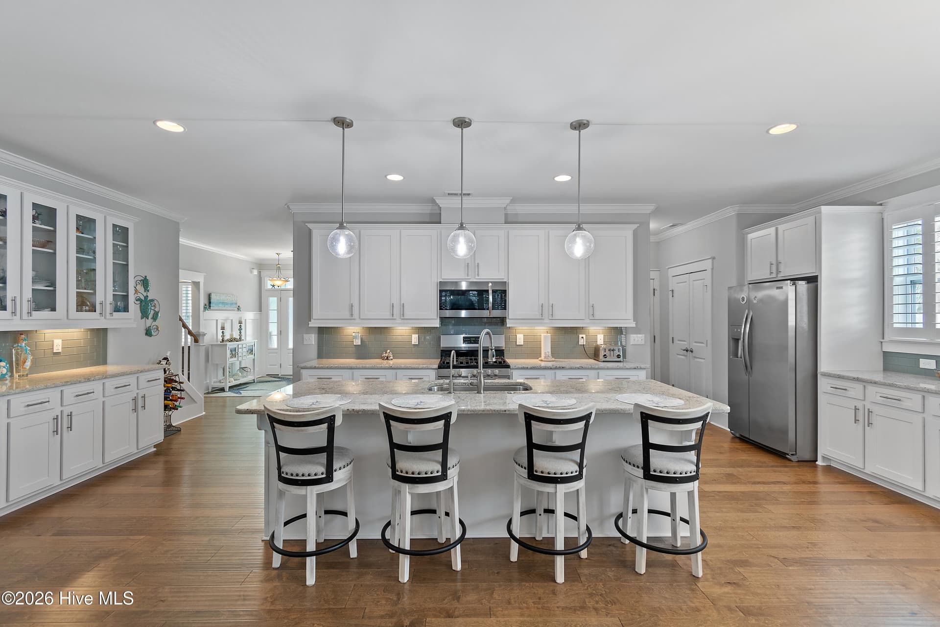 Large kitchen island with barstool seating. - 6358 Bryson Drive SW, Ocean Isle Beach, NC 28469