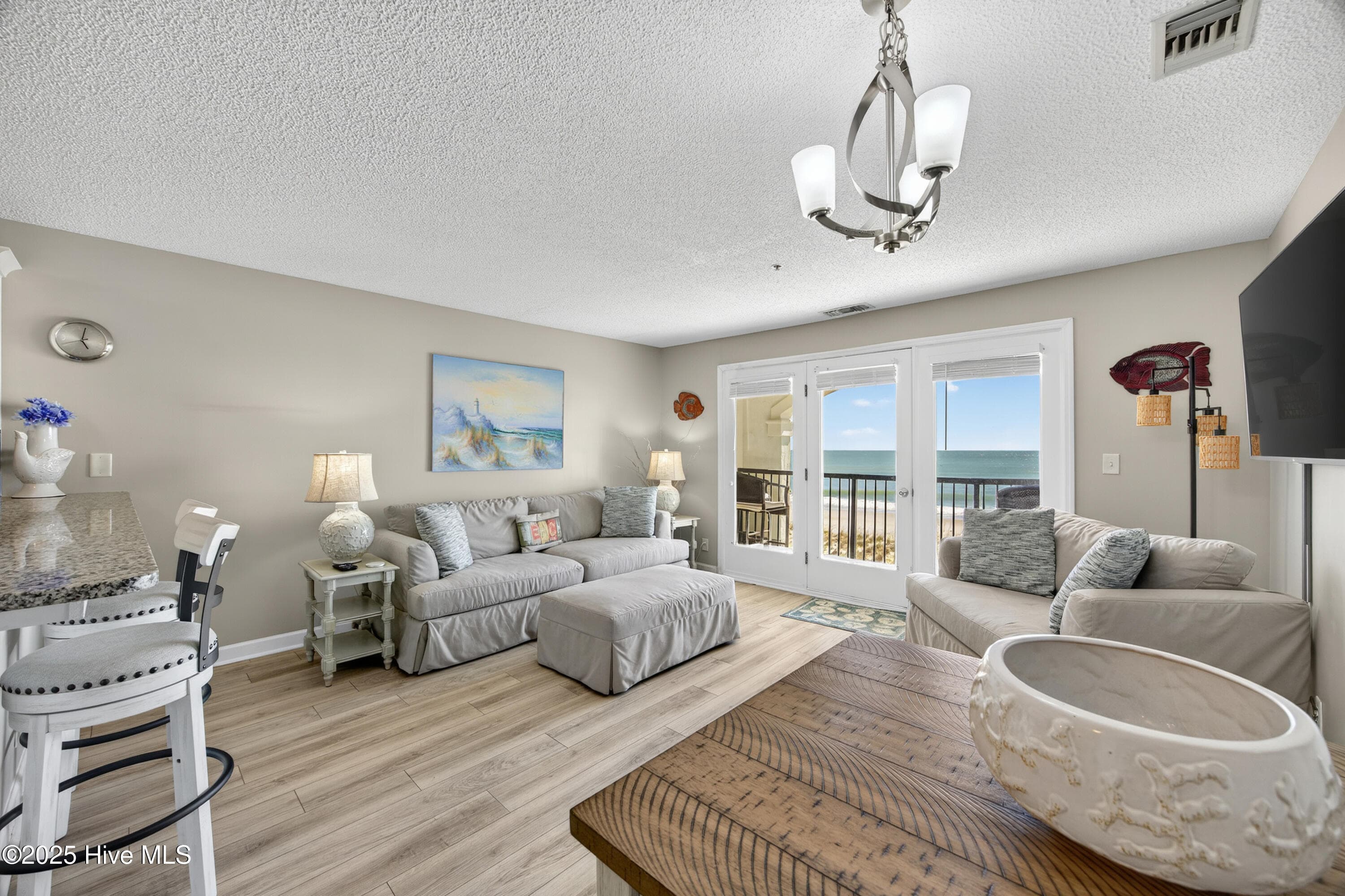 Living room with ocean view - 790 New River Inlet Road Unit 115a, North Topsail Beach, NC 28460