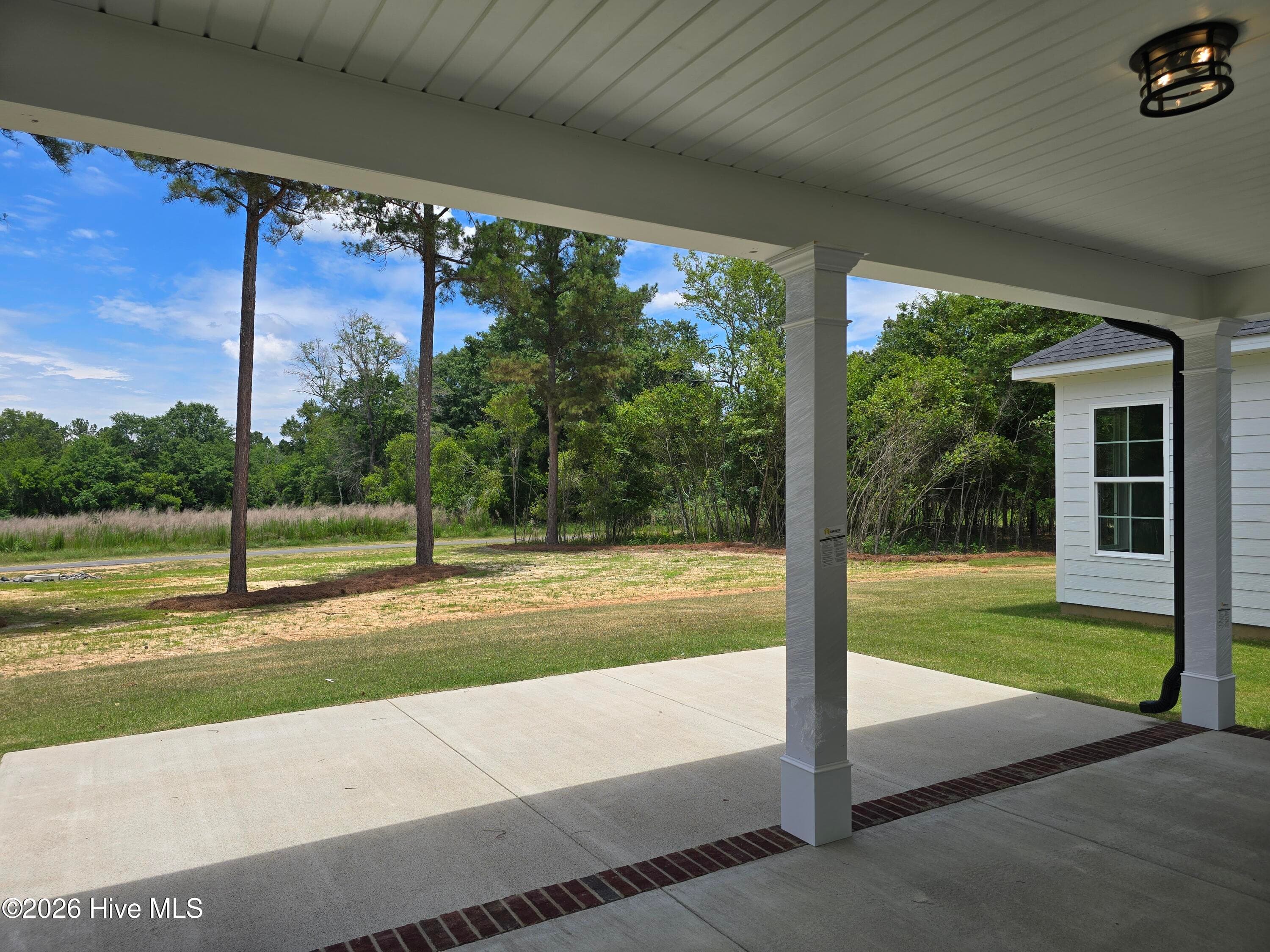 Enjoy the outdoors on the covered rear porch! - 1096 Bellingham Drive, Beech Island, SC 29842