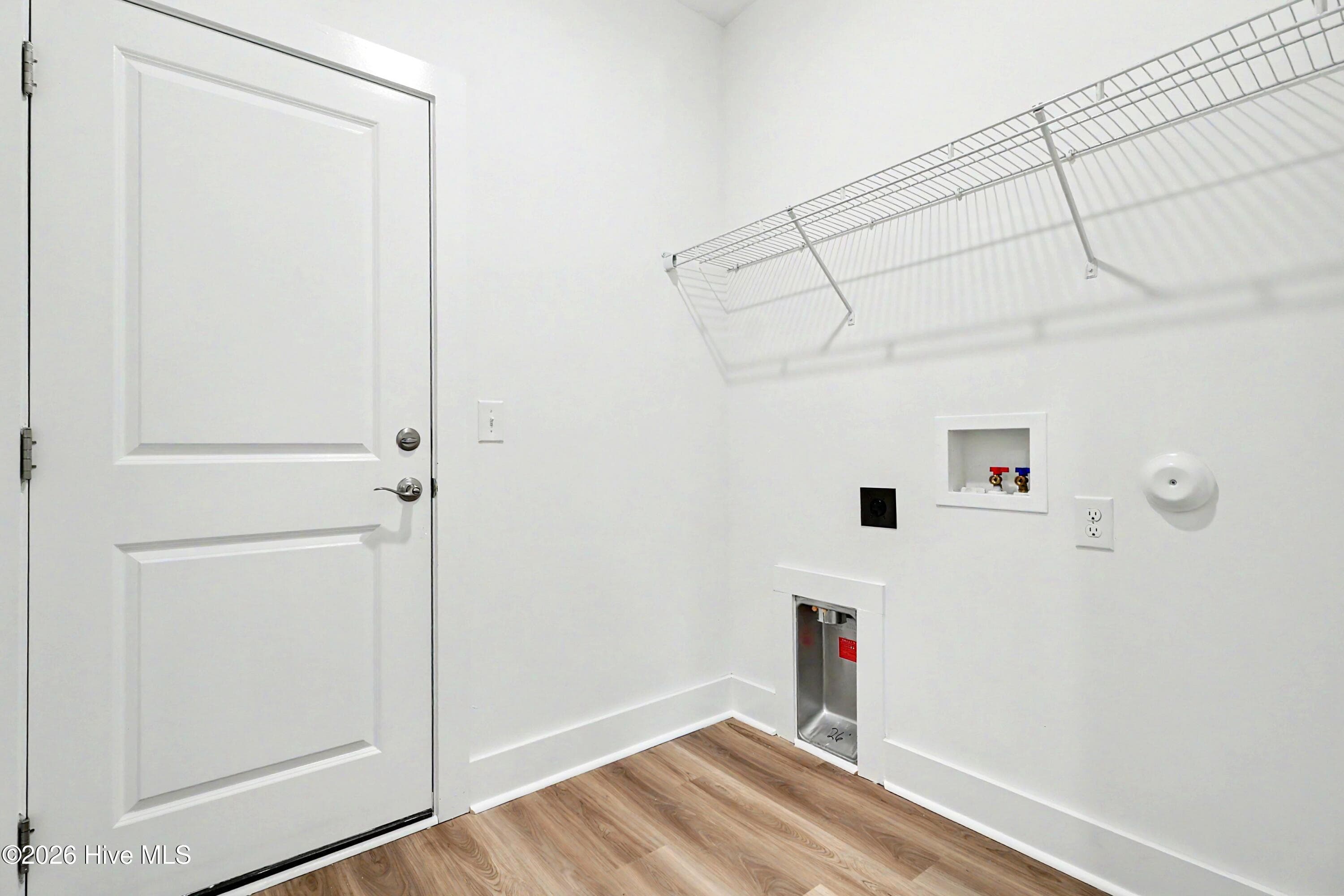 Laundry Room with Access to Garage - 2108 Cregan Cove SW (Lot 2), Ocean Isle Beach, NC 28469