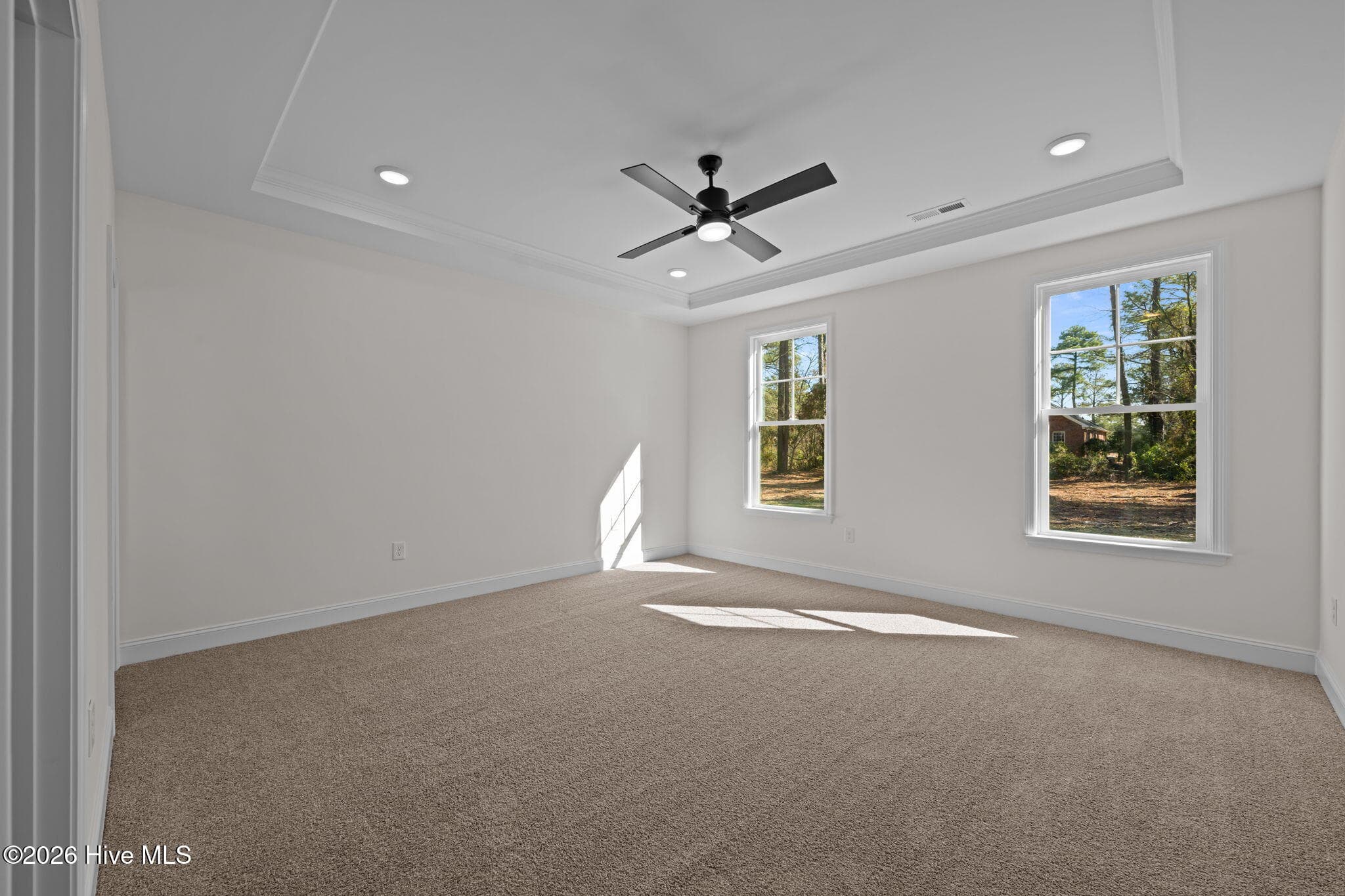 first floor primary suite with tray ceiling - 1216 Petite Terre Court, New Bern, NC 28560