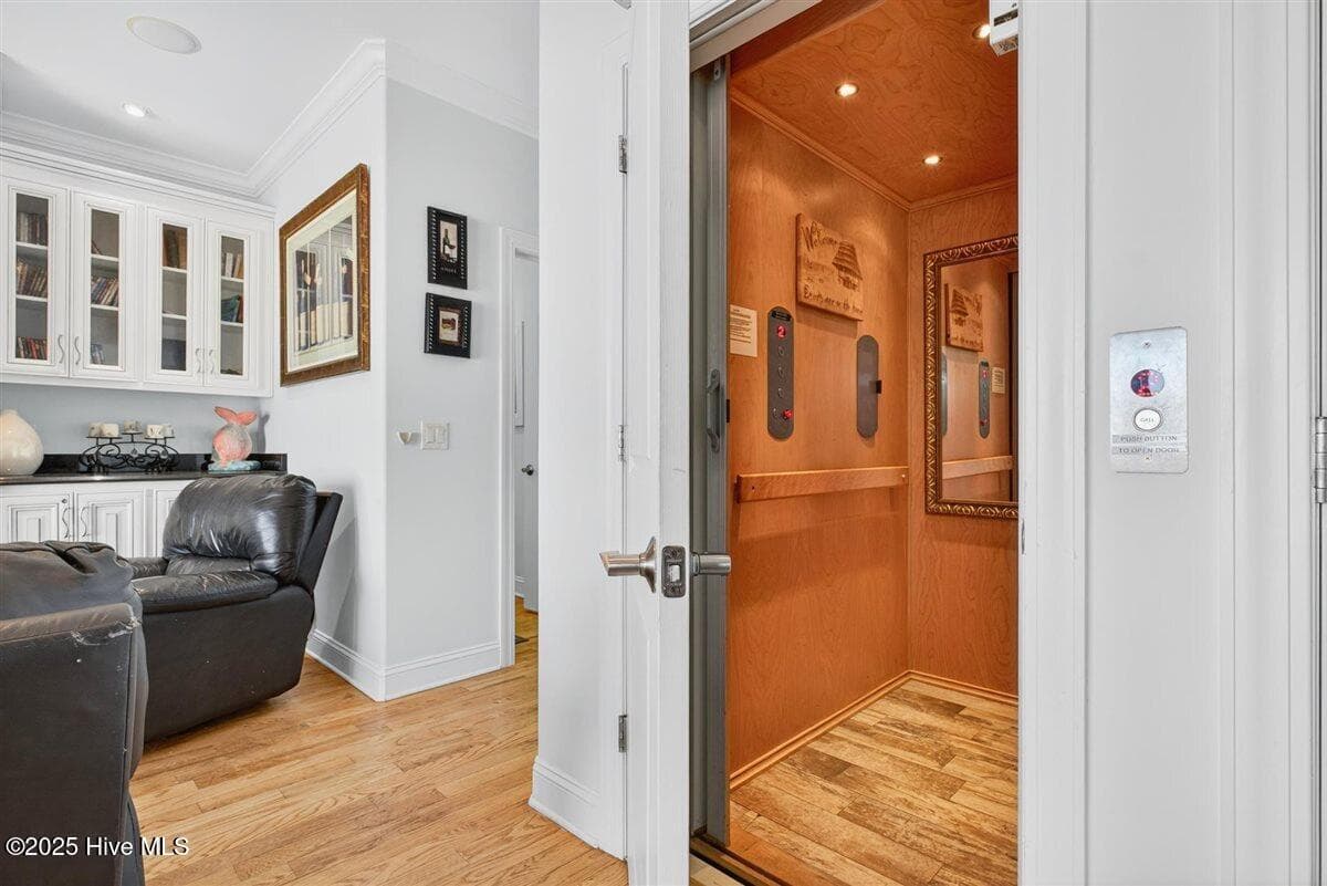 The 3 stop elevator is great for bringing luggage and groceries to first and second floors. - 7 Coggeshall Drive W, Ocean Isle Beach, NC 28469