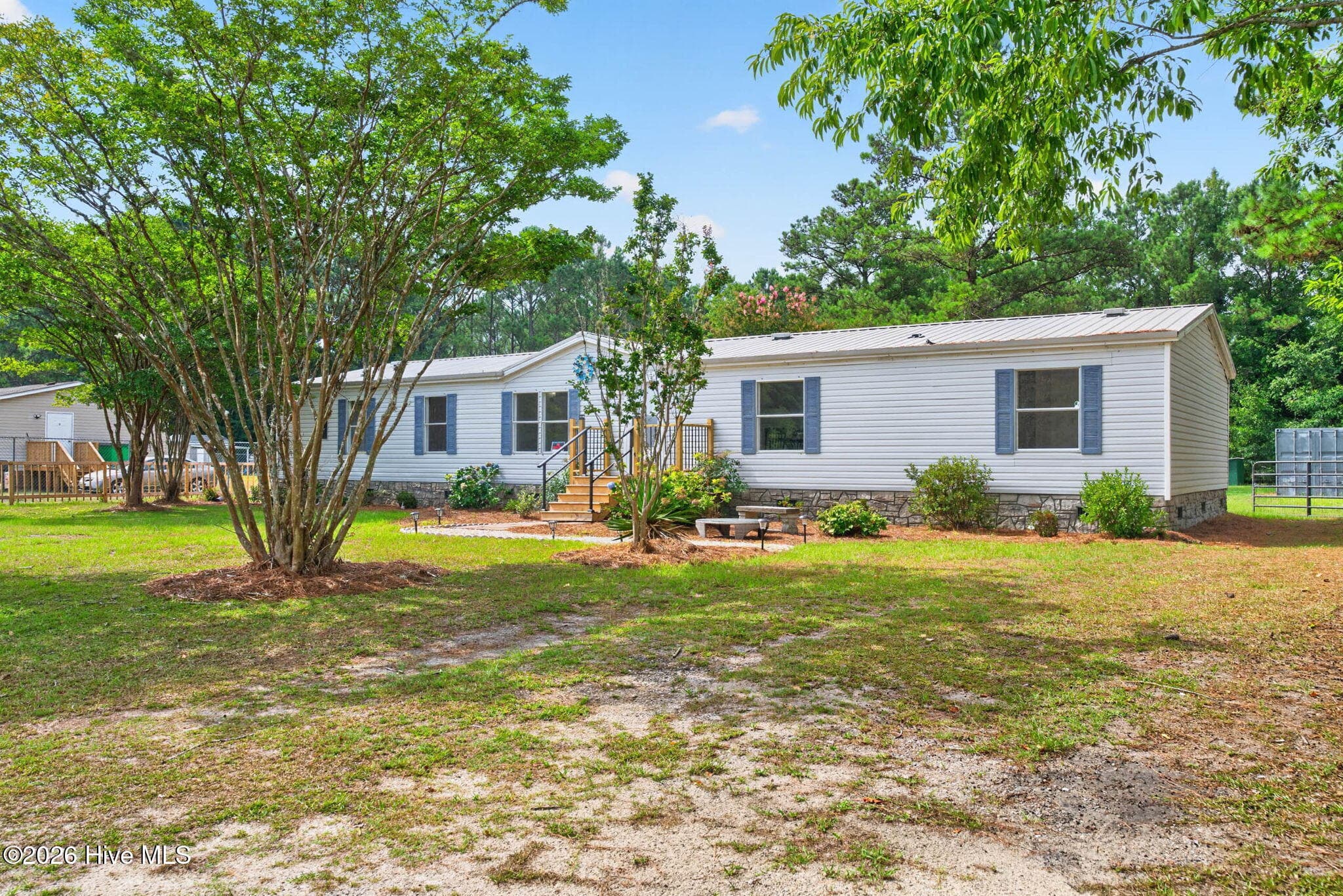 Nestled on a spacious homesite in Sandy Branch Retreat, this updated home combines modern interior finishes with the privacy and charm of country living. - 1199 Zack Street SE, Bolivia, NC 28422