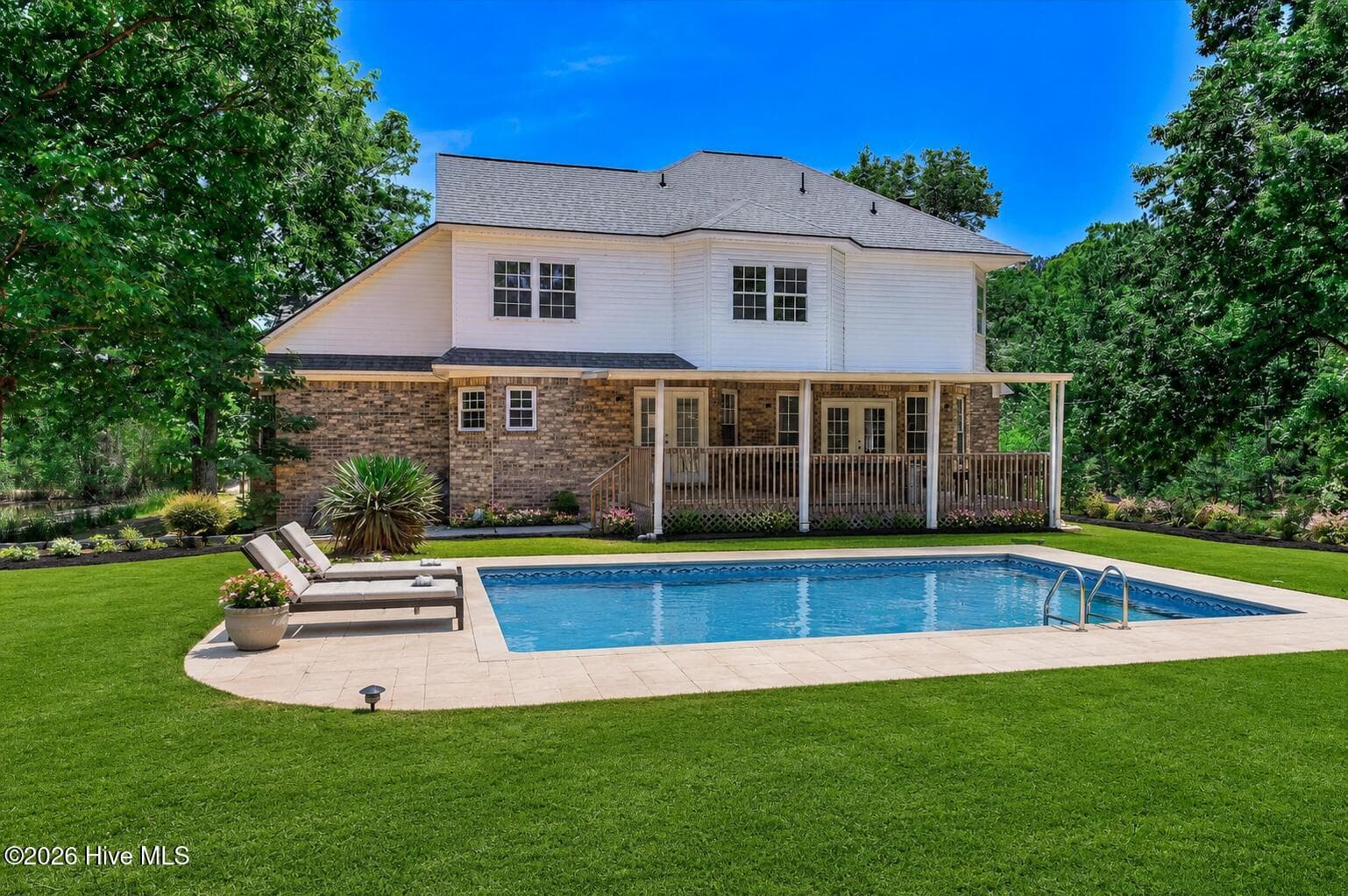 Some photographs have been virtually staged or digitally edited for visualization purposes. The pool shown in the digitally edited backyard image does not currently exist and is intended only to illustrate one possible use of the outdoor space. Original photographs are included. Furniture, decor, landscaping enhancements, appliances and other virtually added items are not included with the sale. - 1154 Water Oak Drive, Lincolnton, GA 30817
