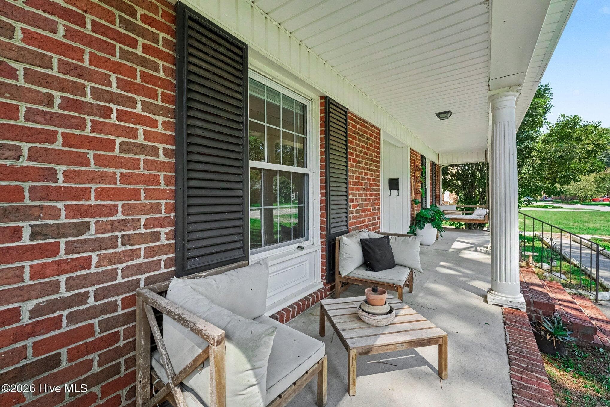 Concrete capped front porch with masonry steps - 1017 S Claiborne Street, Goldsboro, NC 27530