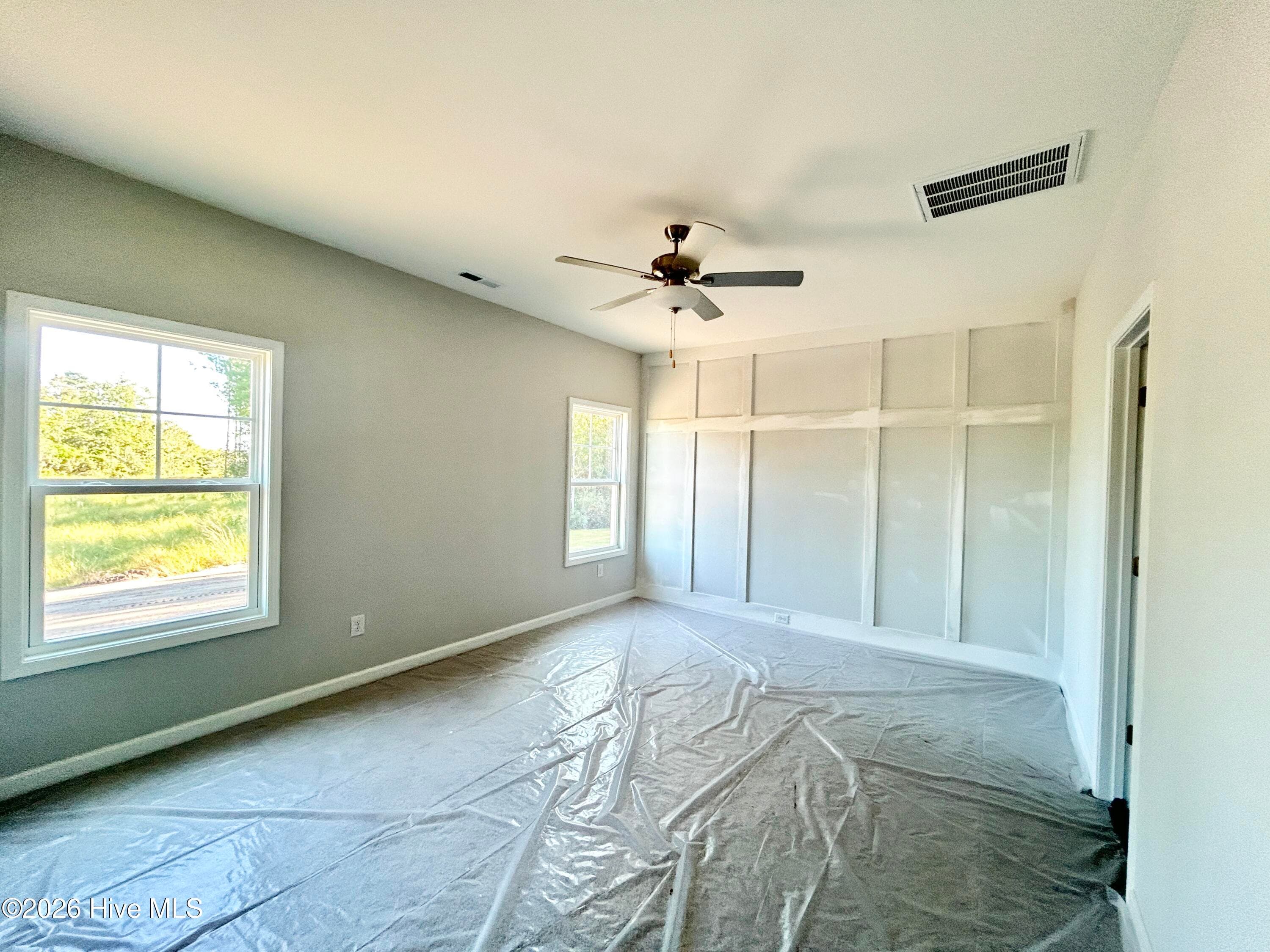 Primary Suite features a Private Bathroom with Tile Shower and Large Walk-in Closet - 4188 Workman Loop 89, Leland, NC 28451