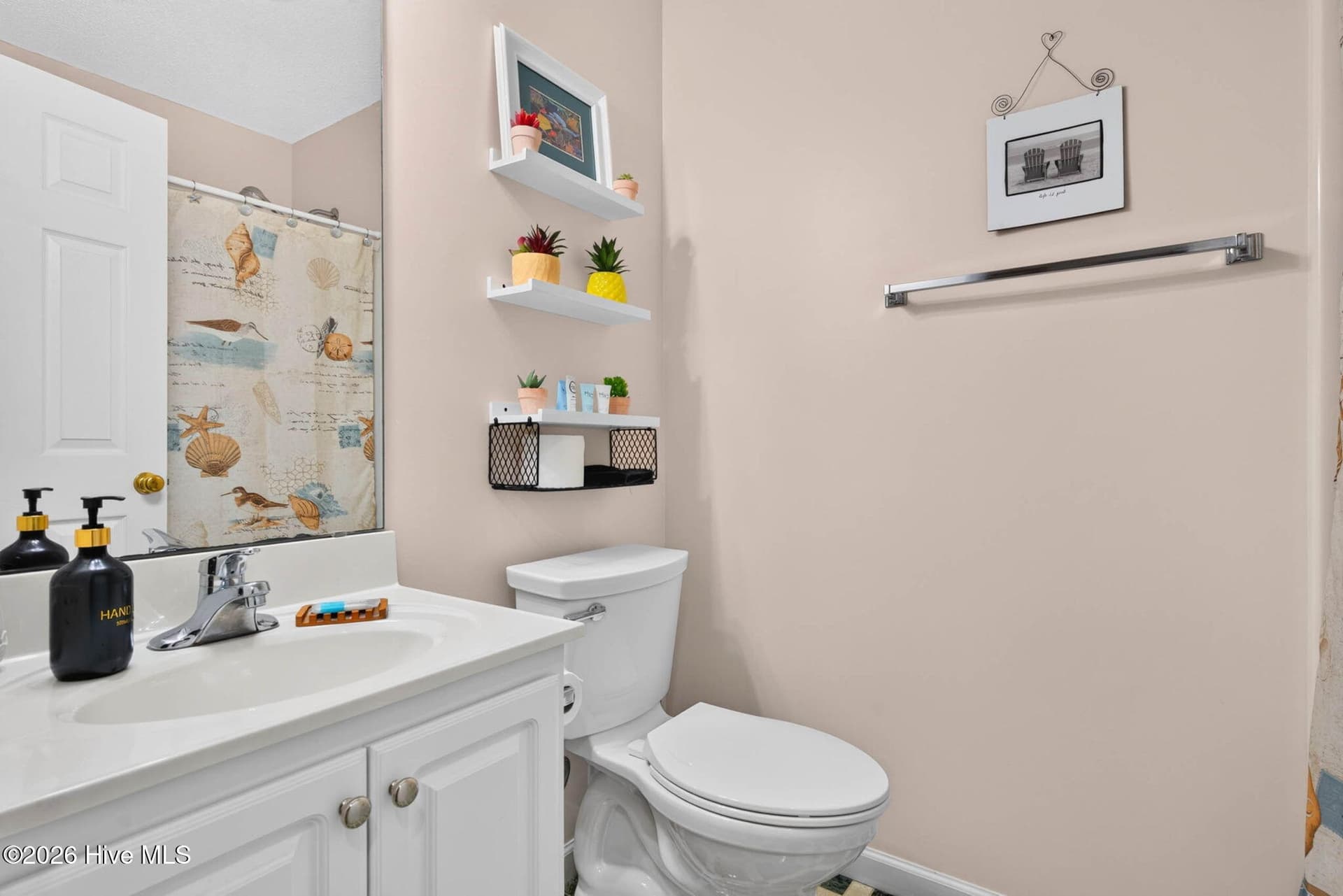 Full guest bathroom conveniently located to serve the home's secondary bedrooms and visitors. - 1650 Frink Street SW, Ocean Isle Beach, NC 28469