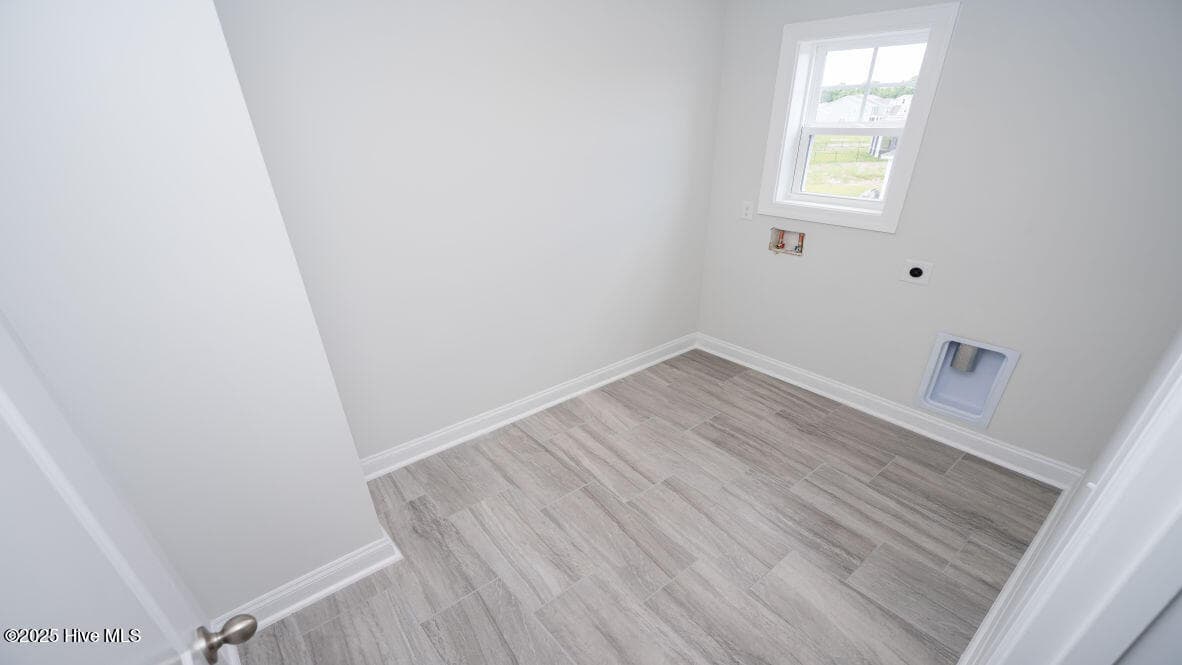 Photo is similar to actual home. Home is currently under construction. Features, colors and options may be different from those shown in representative photos. Call for detailed information. - 3221 Butterfly Ginger Street Lot 74, Leland, NC 28451