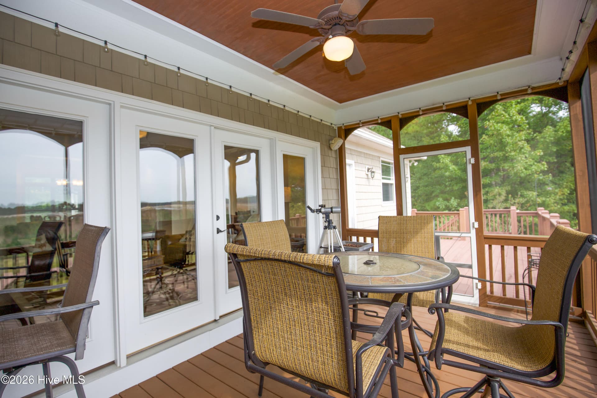 Screened back porch off the living room, reached through French doors. - 899 Seagull Drive, Vass, NC 28394