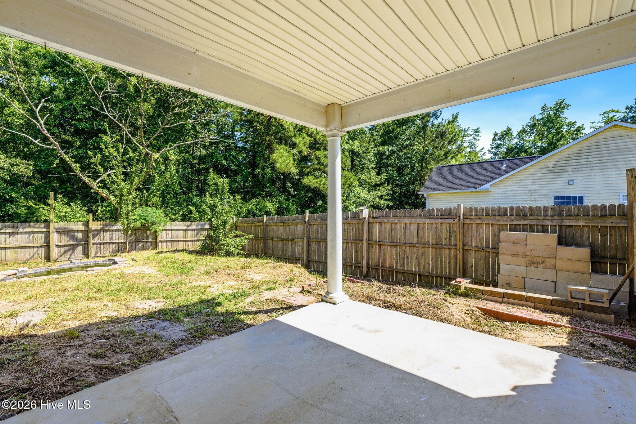 Rear Covered Patio and yard - 215 Gardenview Court NE, Leland, NC 28451
