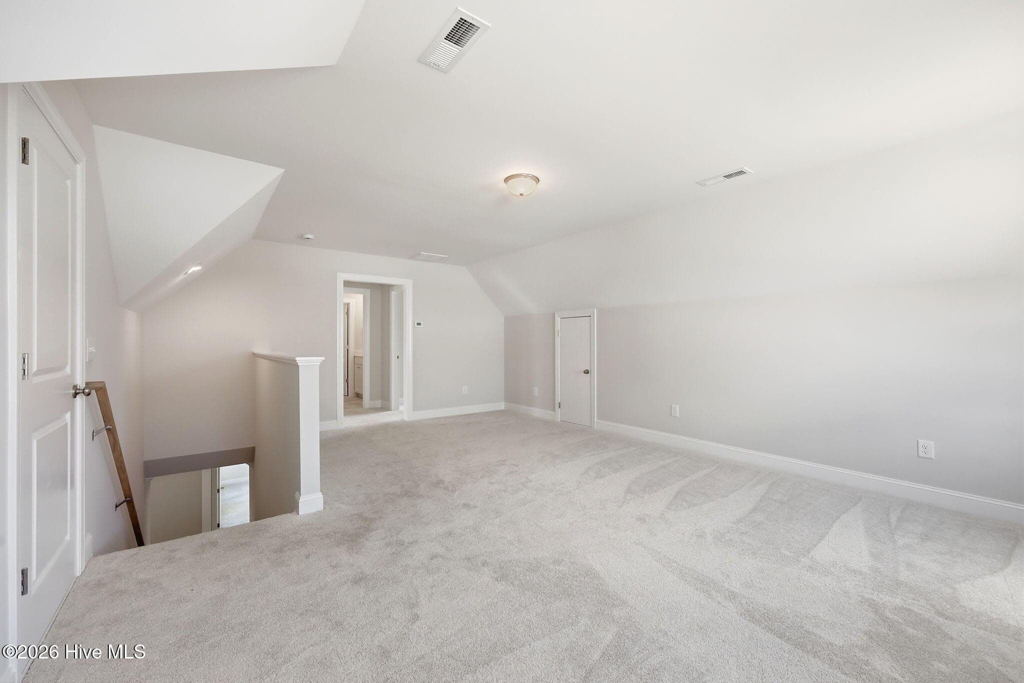 top of stairs, enter to a large bonus room that will take you to TWO MORE bedrooms and a FULL Bath - 1005 Finn Court, Greenville, NC 27834