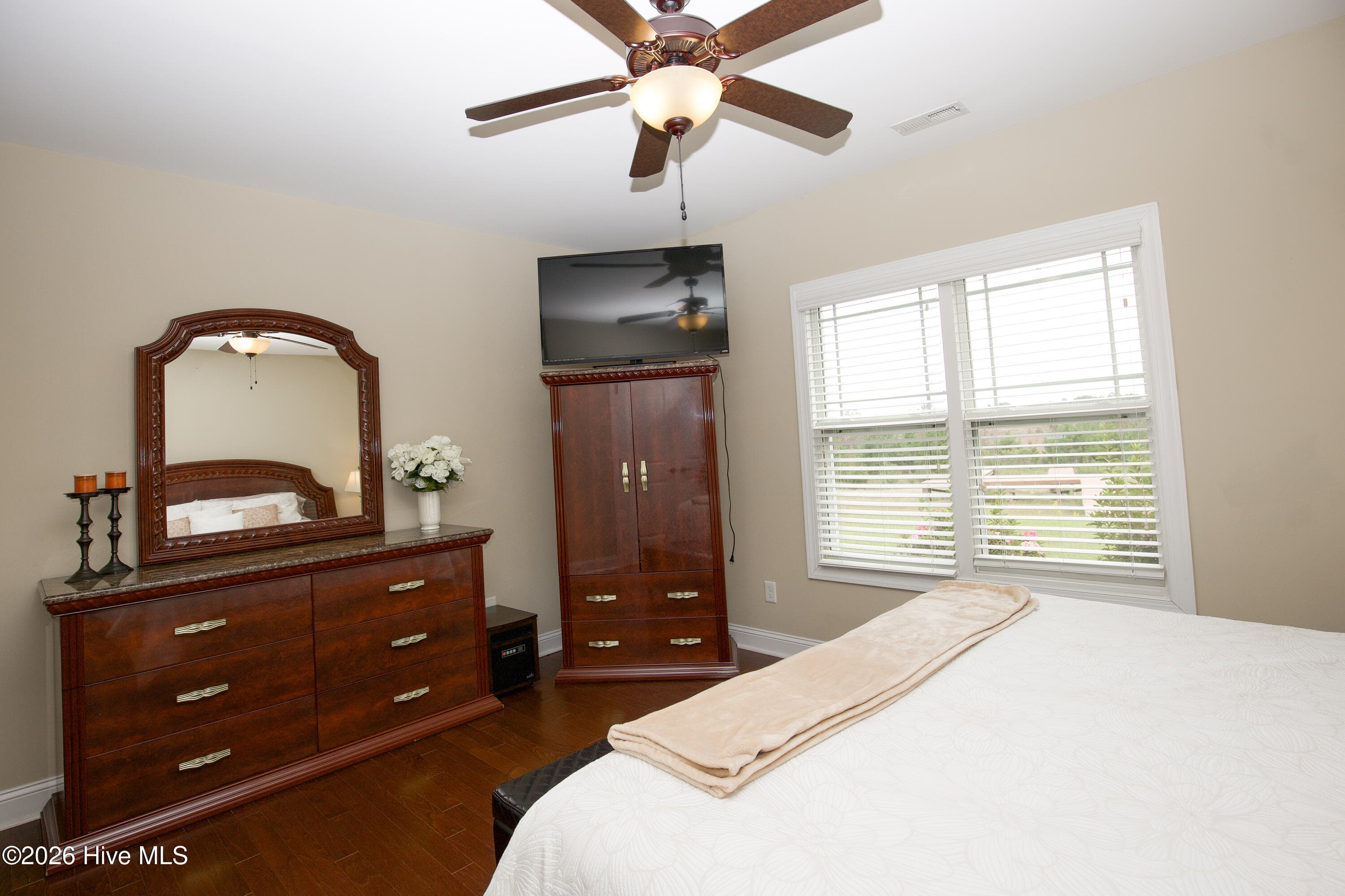 Lower-level bedroom with room for a dresser and armoire. - 899 Seagull Drive, Vass, NC 28394, Vass