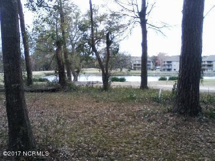 View of Oyster Bay golf hole and pond - Lot 7 Lakeshore Drive, Sunset Beach, NC 28468