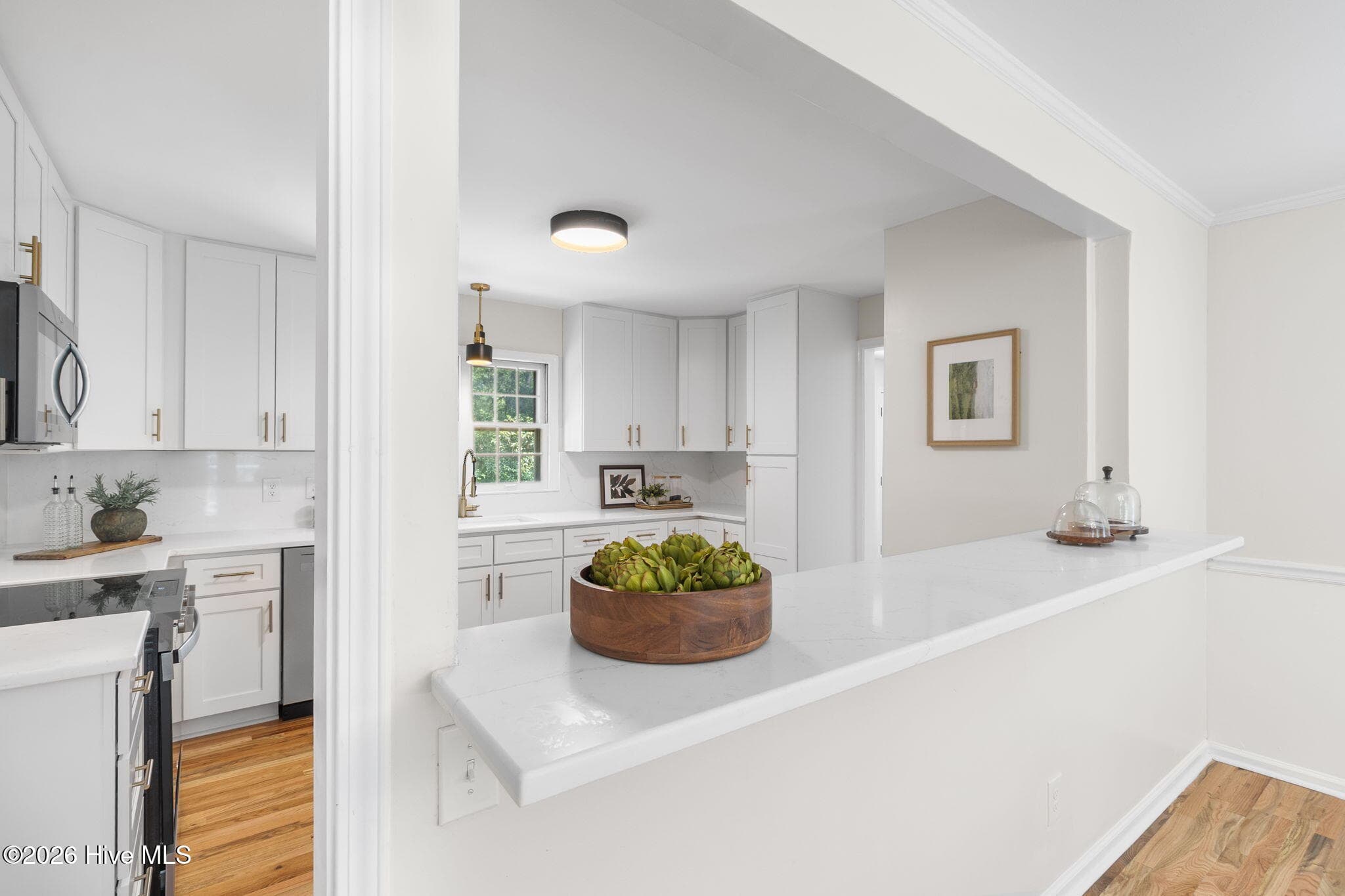 Breakfast bar between kitchen and dining room - 102 James Creek Road, Southern Pines, NC 28387