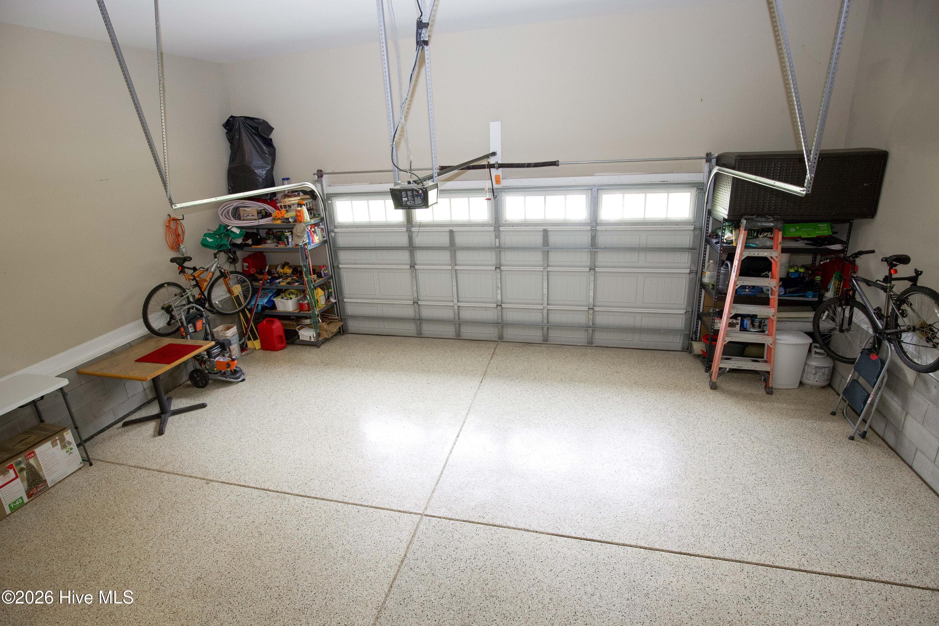 Attached two-car garage with an epoxy-coated floor. - 899 Seagull Drive, Vass, NC 28394, Vass