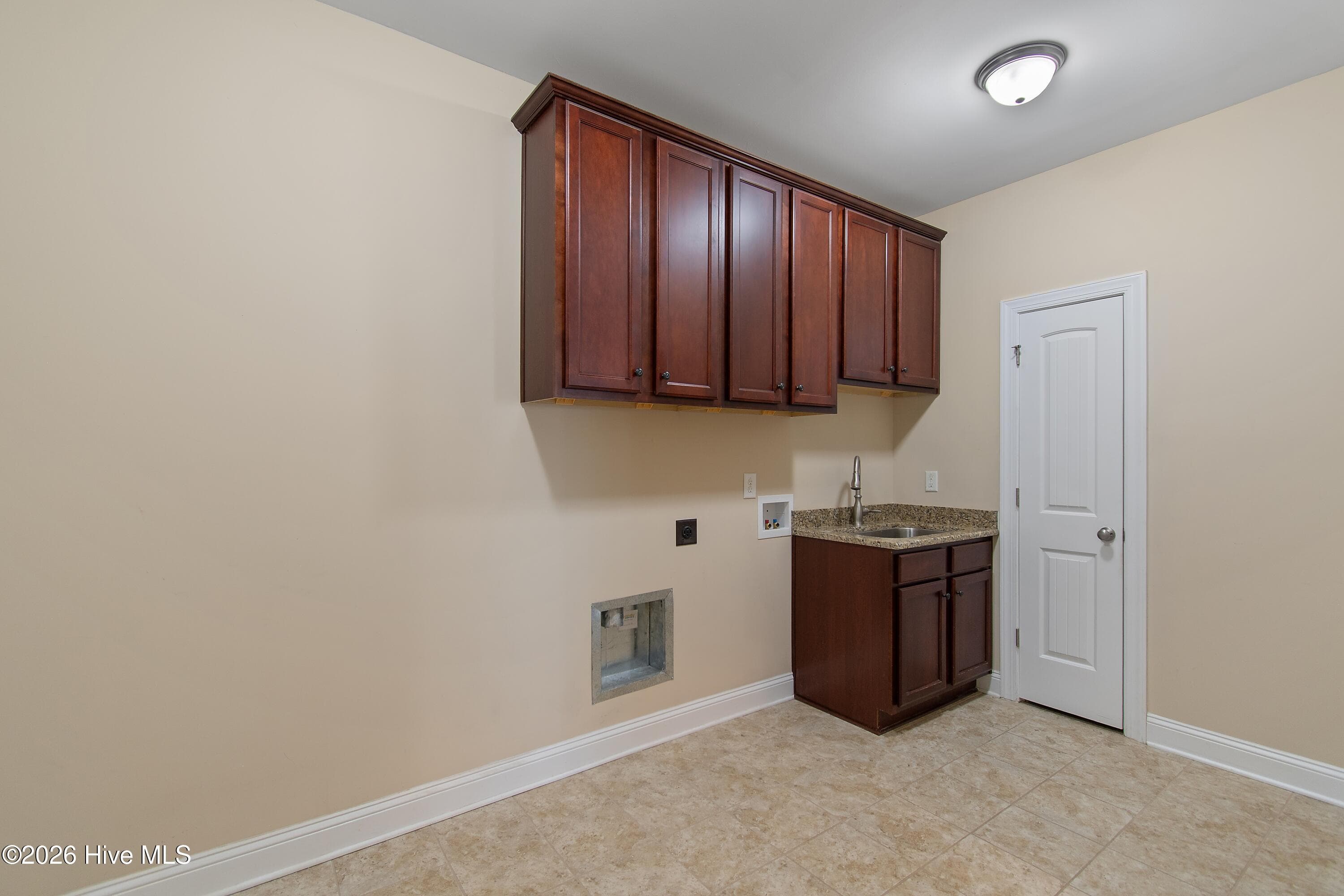 Laundry room attached to garage, a great 'drop zone'. - 1674 Back Bay Drive SW, Shallotte, NC 28470