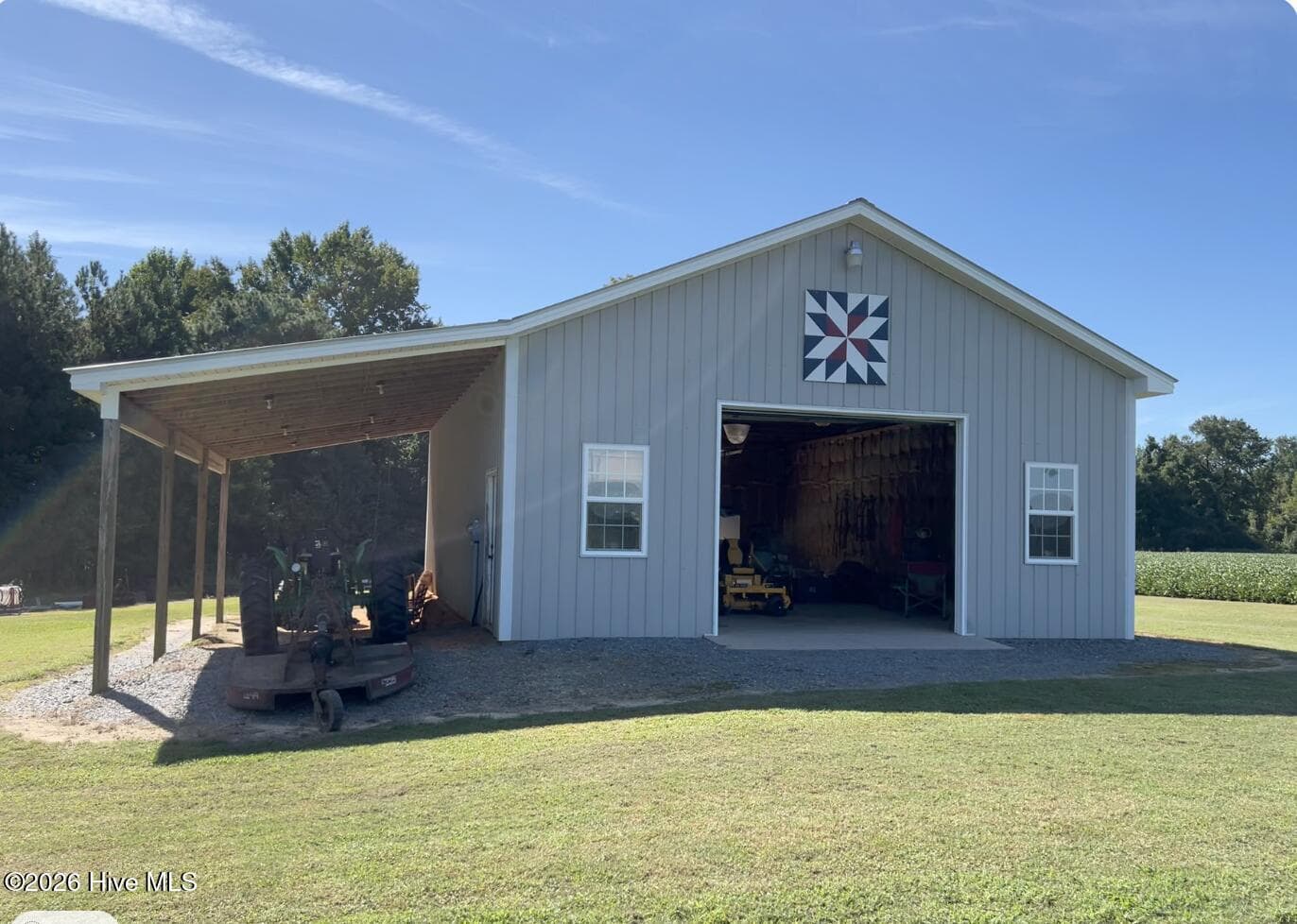 30 X 40 Detached workshop with 15 X 40 Shelter. - 642 Enoch Road, Clinton, NC 28328