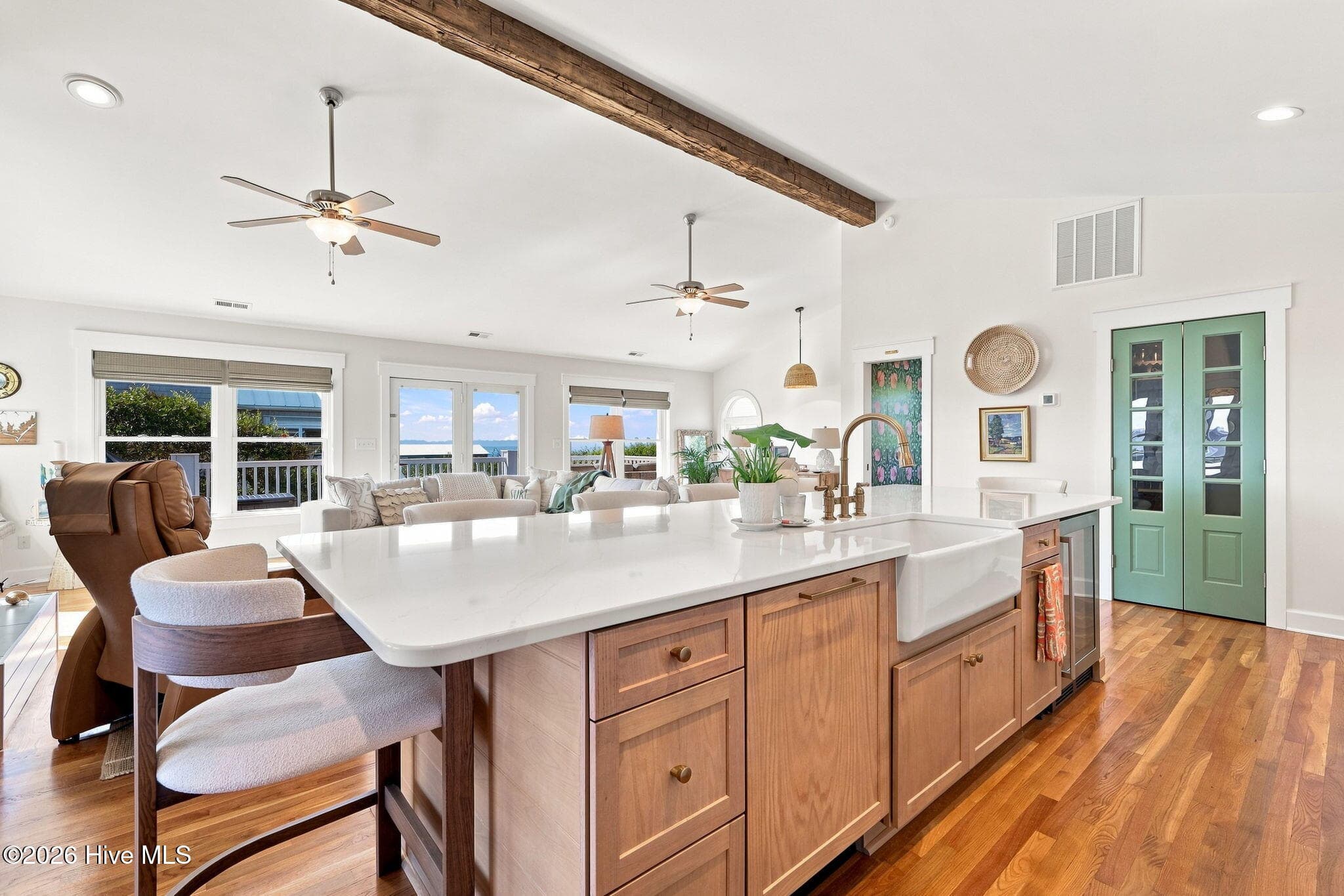 An entertainer's kitchen with generous counter space, beautiful finishes, and seamless flow into the main living areas. - 103 Georgia Street, Emerald Isle, NC 28594