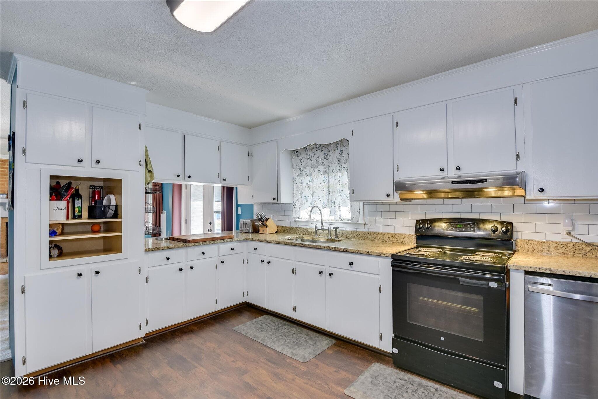 Oversized kitchen with newly installed granite counter tops and plenty of cabinet space along with laundry room that can double as a walk-in pantry! - 1445 Pine Log Road, Aiken, SC 29803