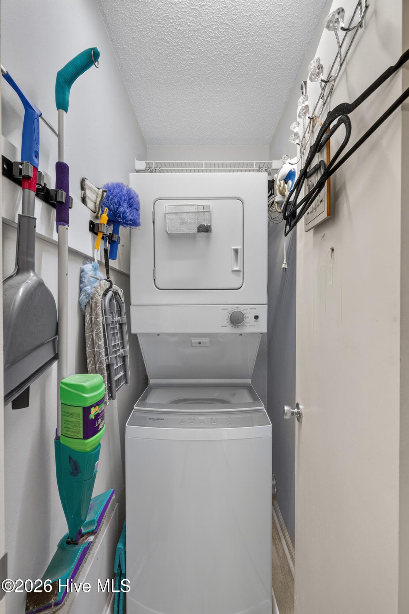 Laundry room PLUS there is another full sized washer in the carport level. - 301 Bay Circle, North Topsail Beach, NC 28460