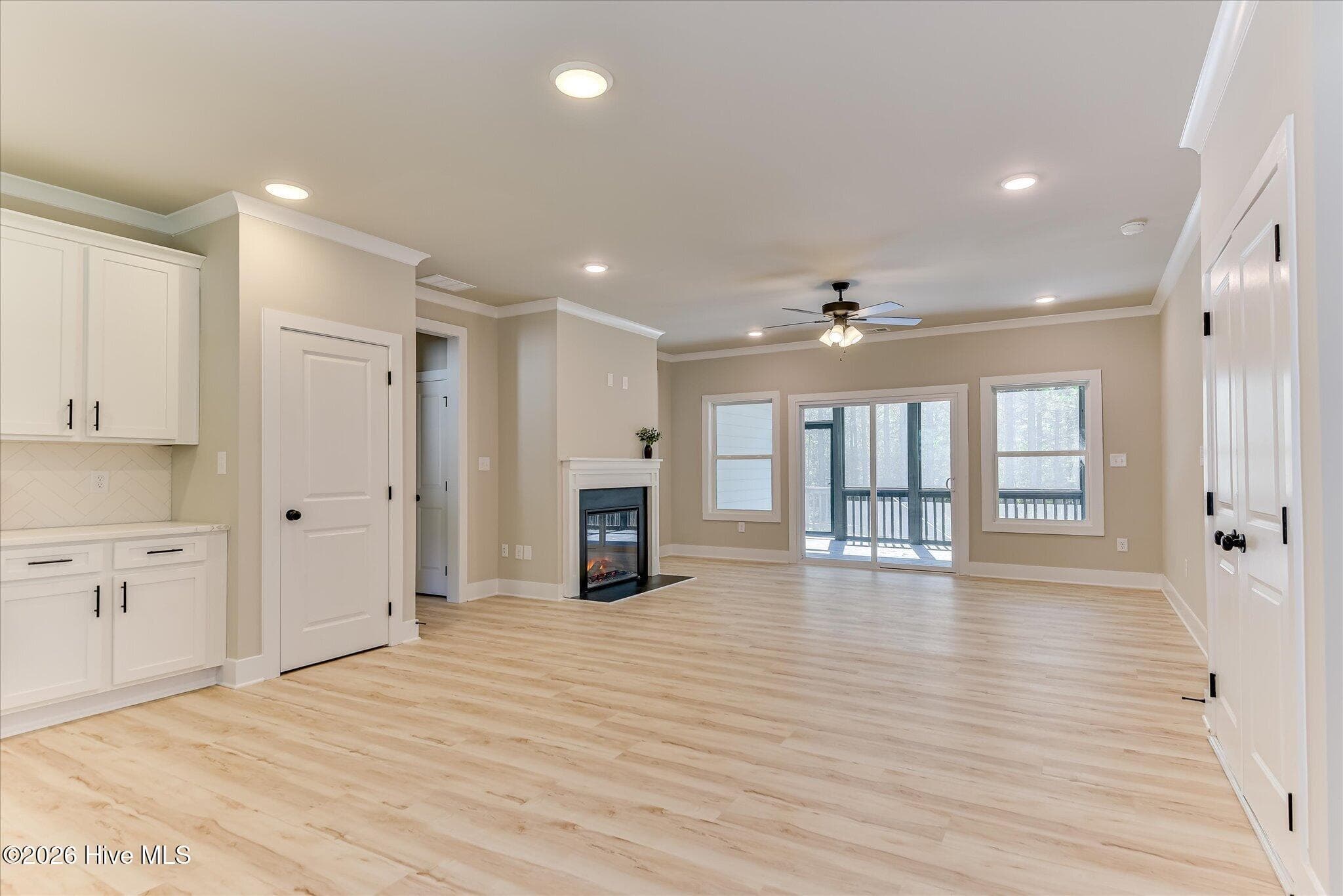 Open, split floor plan, kitchen/living/dining, an abundance of natural light - 1198 Sunset Cove, Tignall, GA 30668