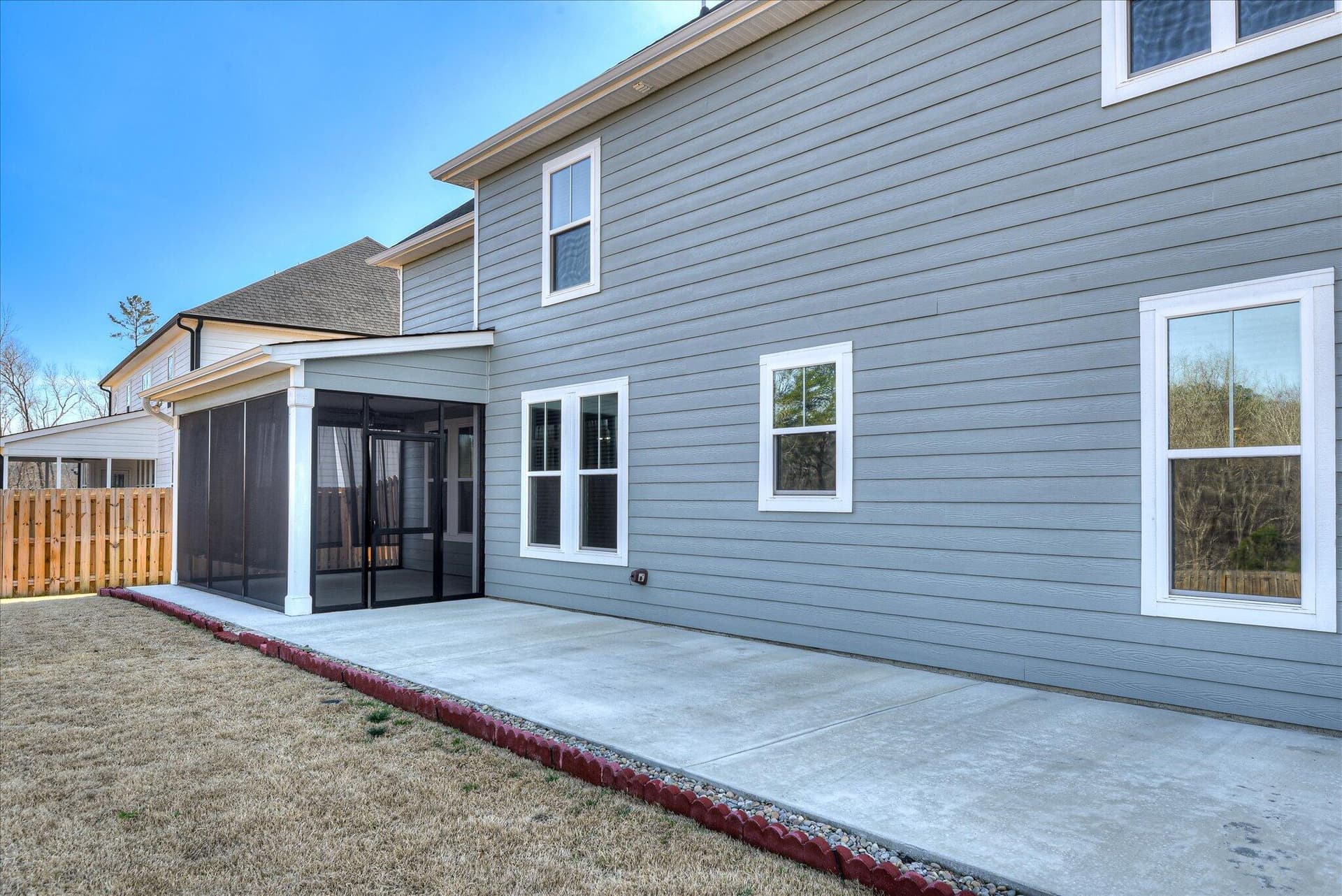 Extended concrete patio area with side walk to front of home - 903 Lillian Park Drive, Grovetown, GA 30813