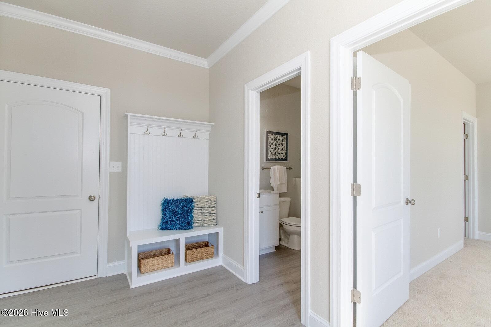 Sample photo of mudroom; leads to 1st floor flex room that has access to full bath with shower; mudroom comes with bench - 122 Arbormoor Lane, Moyock, NC 27958