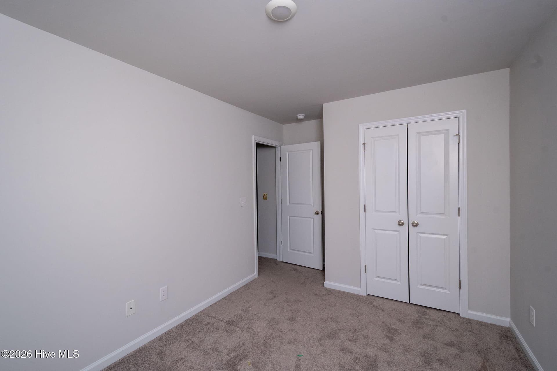 Bedroom 2 looking towards the Hall - 7619 Knightbell Circle, Leland, NC 28451