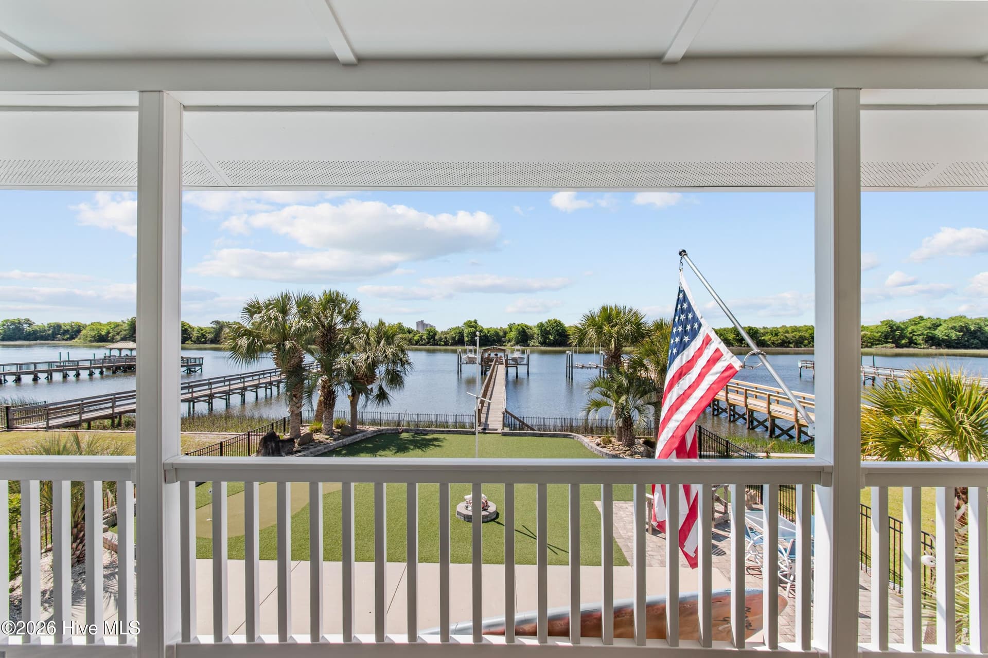 Views from the back porch off of the living room/kitchen. - 2024 Camelot Drive SW, Ocean Isle Beach, NC 28469