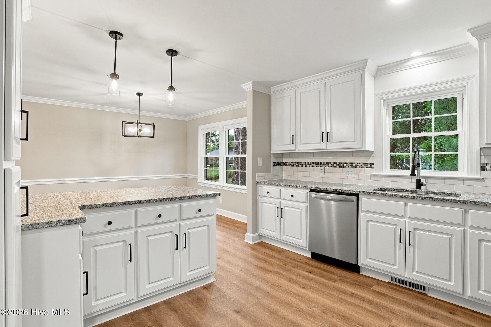 Updated kitchen with new flooring and cabinets - 2214 Somerset Drive N, Wilson, NC 27893