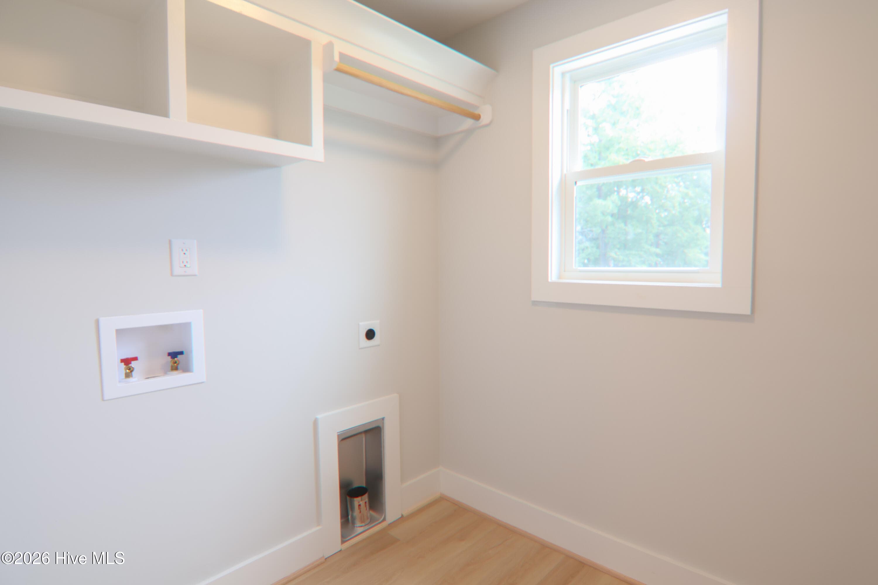 Laundry room with cubbies and rod - 223 Glenwood Trail, Goldsboro, NC 27534