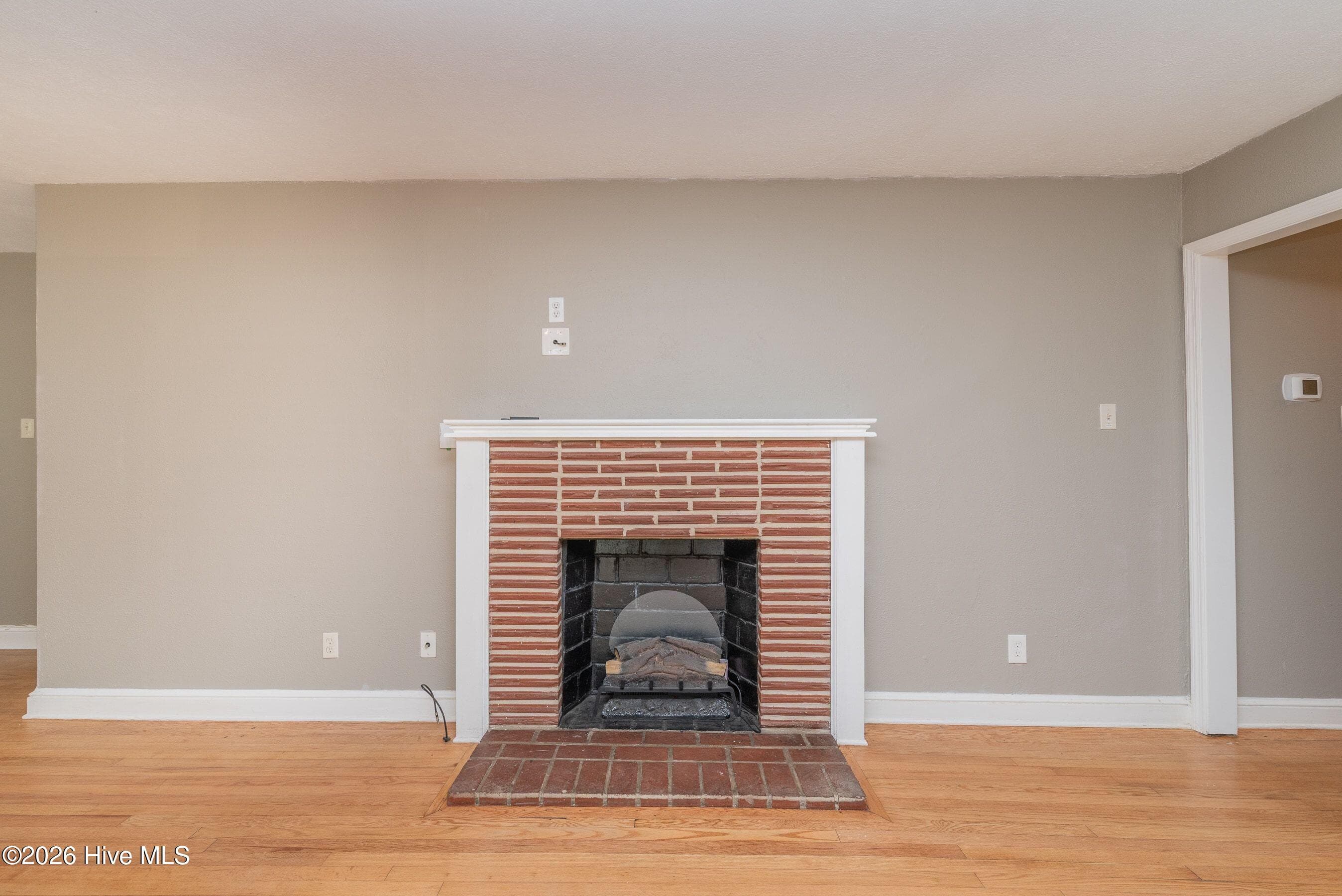 Fireplace with electric logs - 210 Dunbarton Circle SE, Aiken, SC 29803