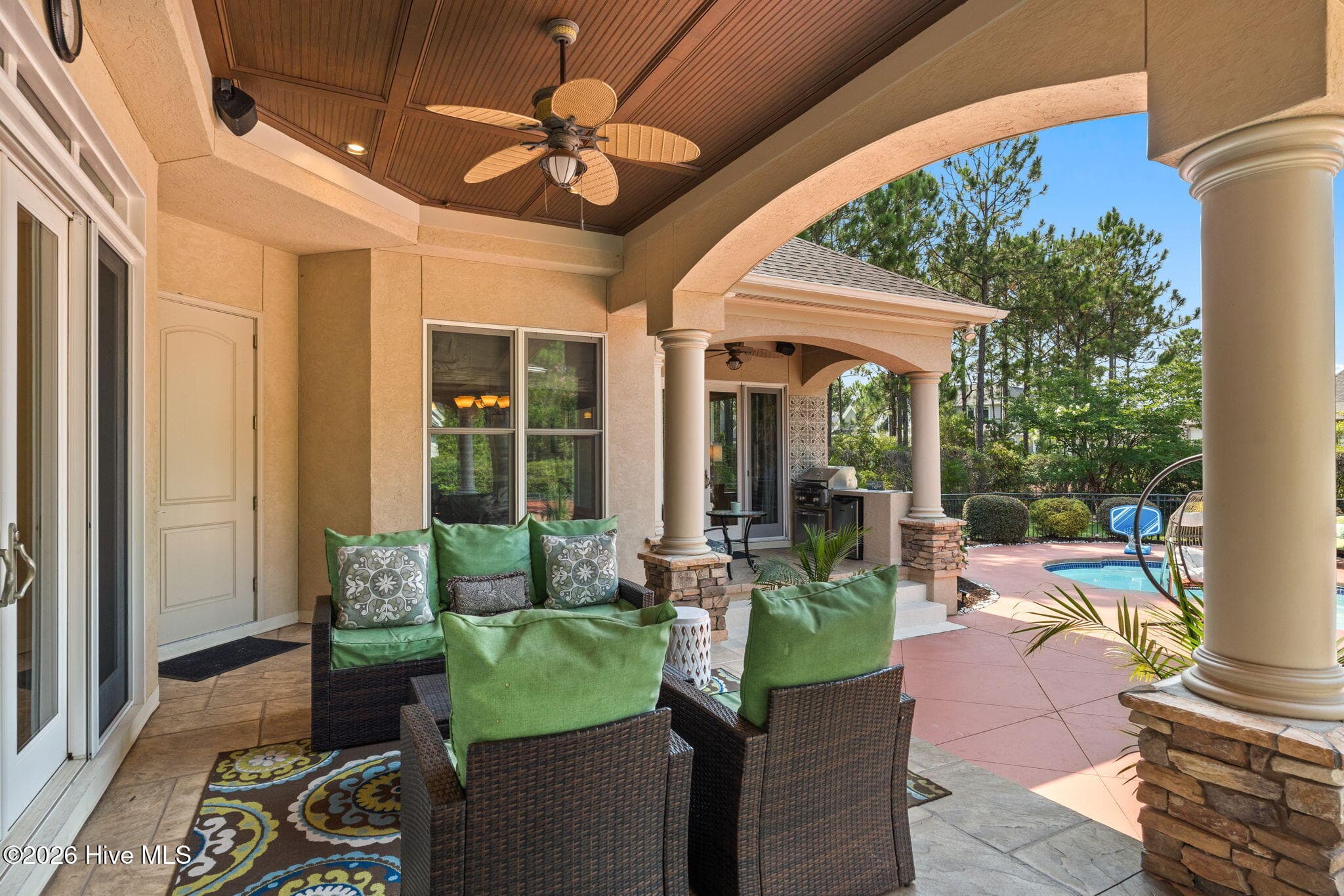 One of 3 seating areas overlooking the pool - 3858 Ridge Crest Drive, Southport, NC 28461