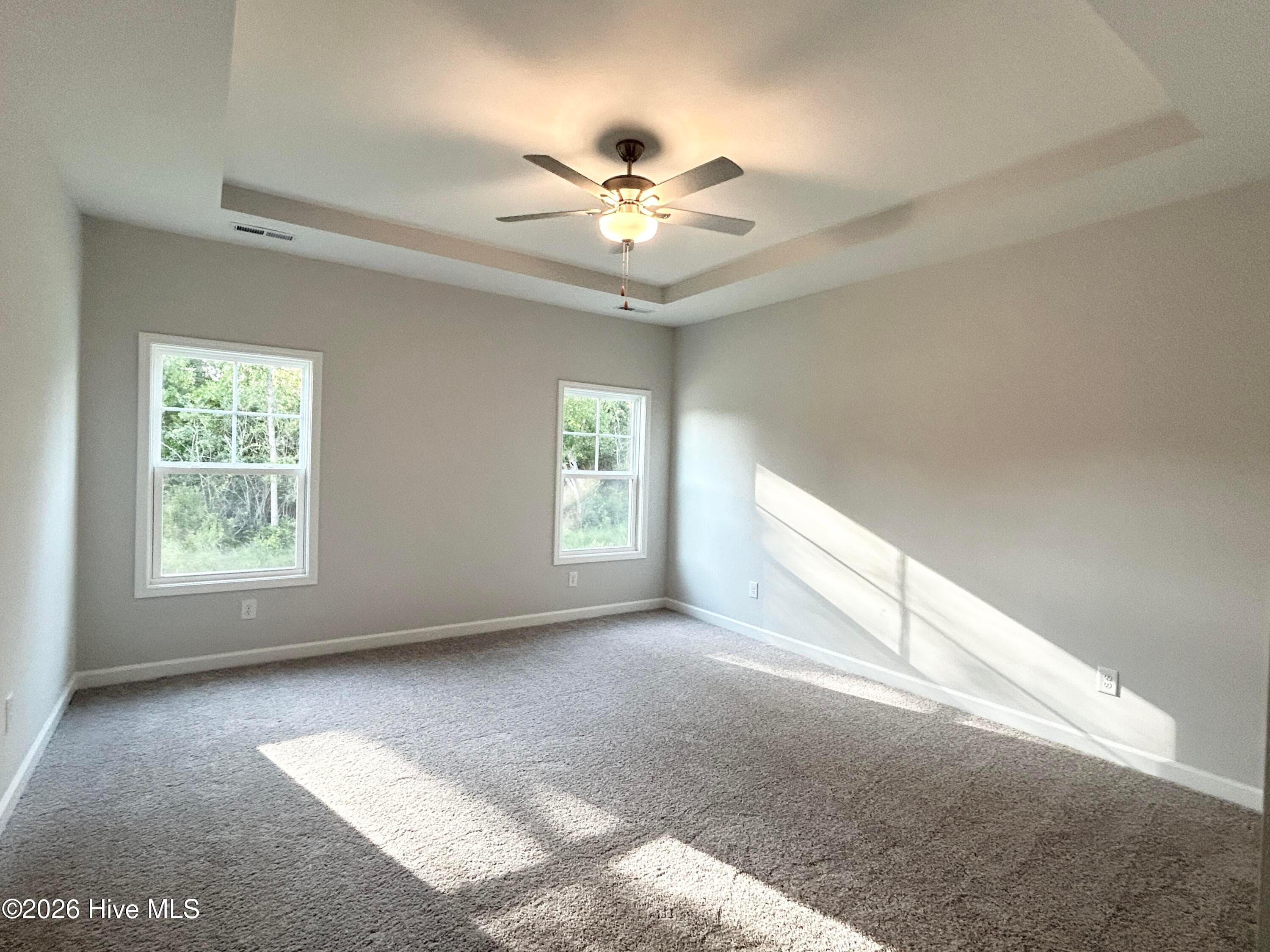Primary Suite features a Private Bathroom with Tile Shower and Large Walk-in Closet - 4153 Workman Loop 68, Leland, NC 28451