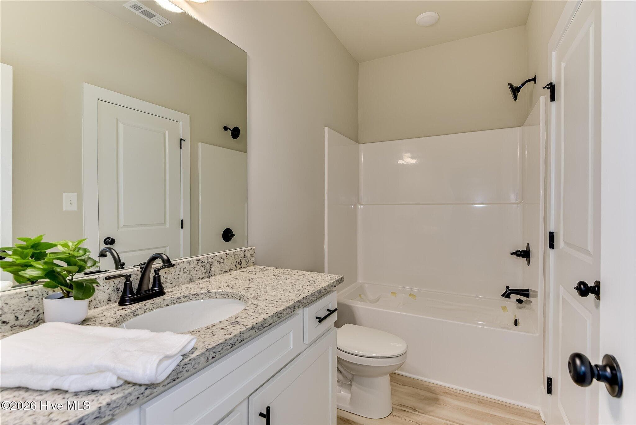Full bathroom shared by Bedrooms 2 and 3 - 1198 Sunset Cove, Tignall, GA 30668