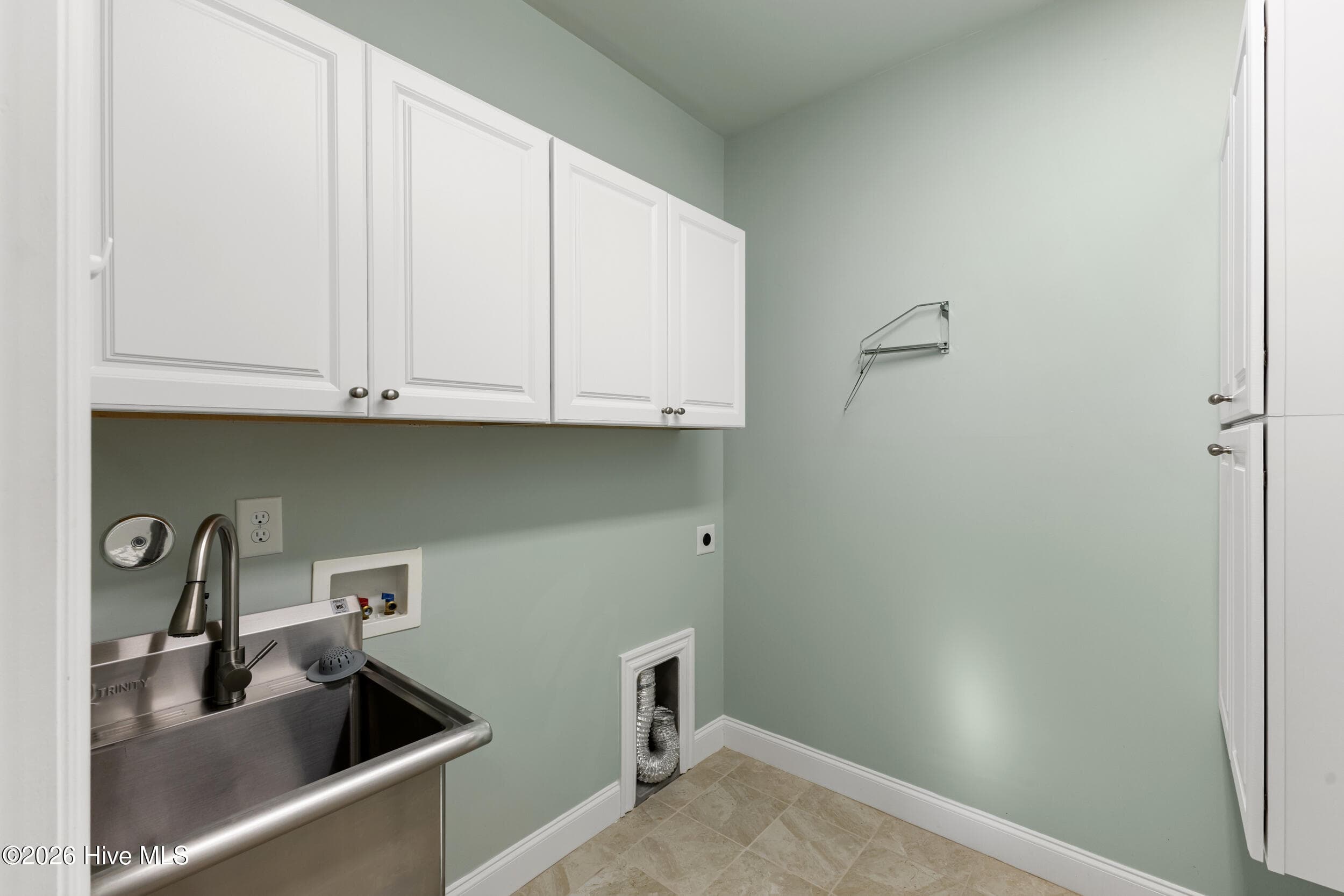 Laundry room with stainless steel sink and cabinets - 615 Jenoa Drive, Castle Hayne, NC 28429