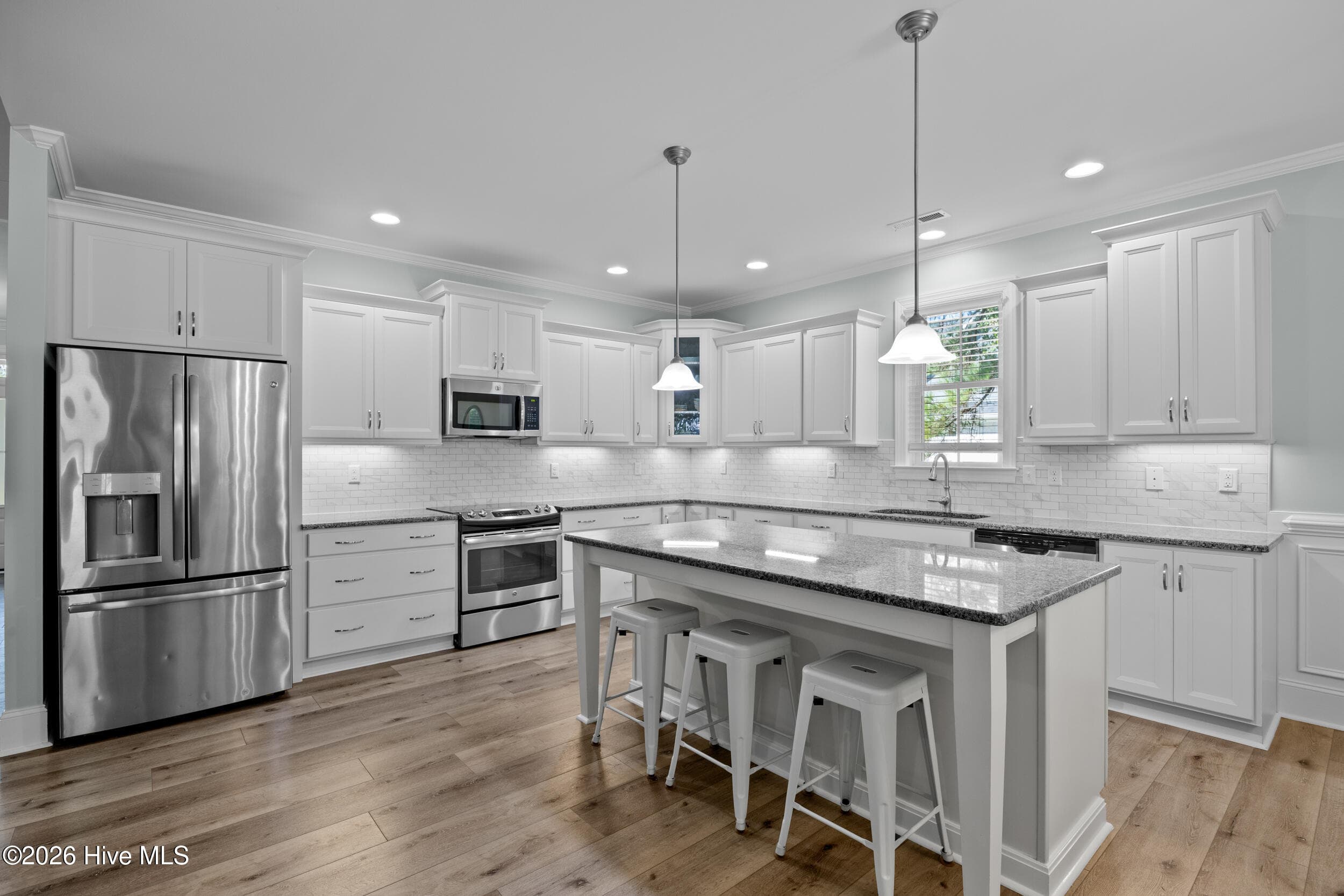 Kitchen with stainless appliances - 323 Crown Pointe Drive, Hampstead, NC 28443