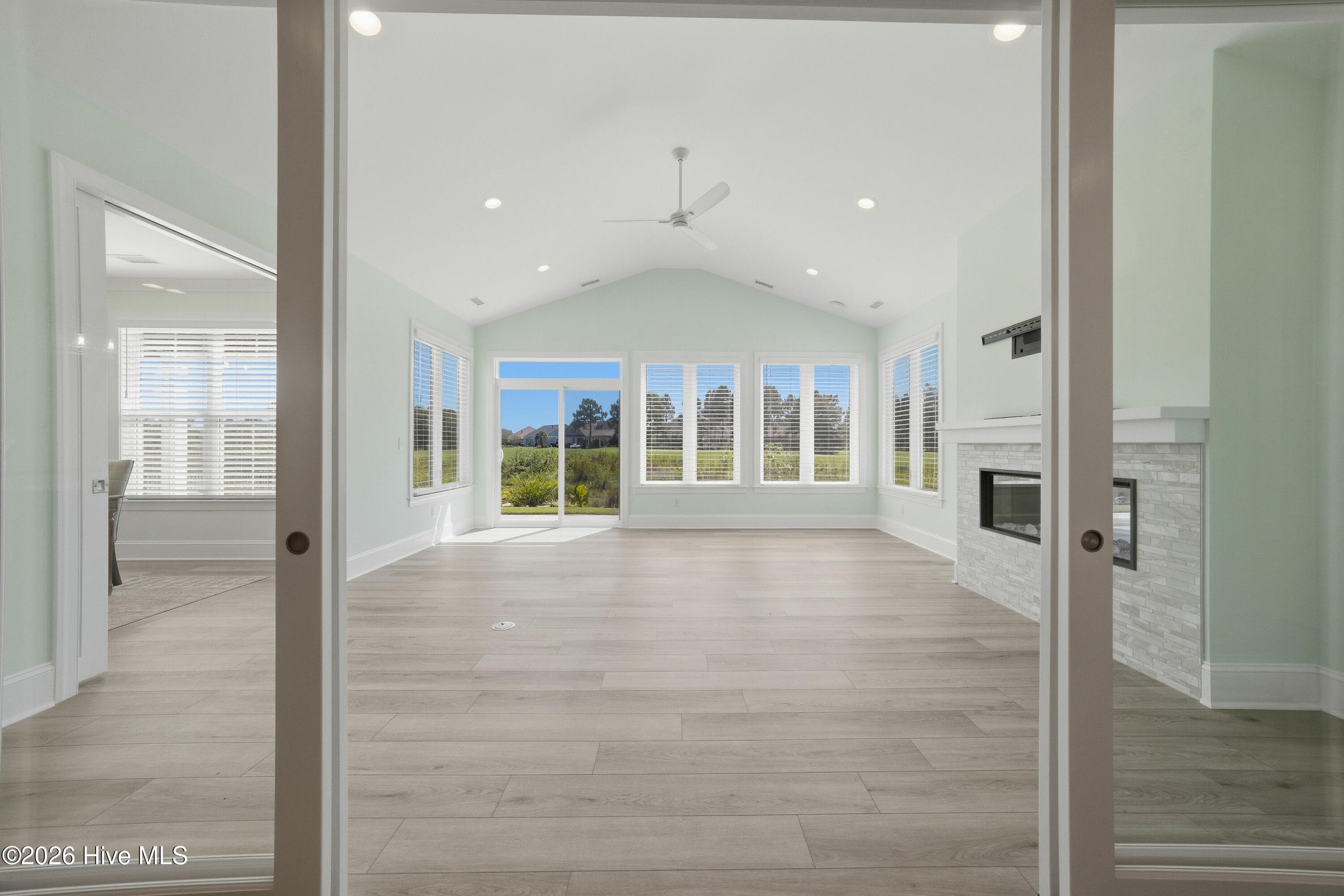Pocket doors into family room with fireplace and full HVAC - 2359 Weeping Birch Road NE, Leland, NC 28451
