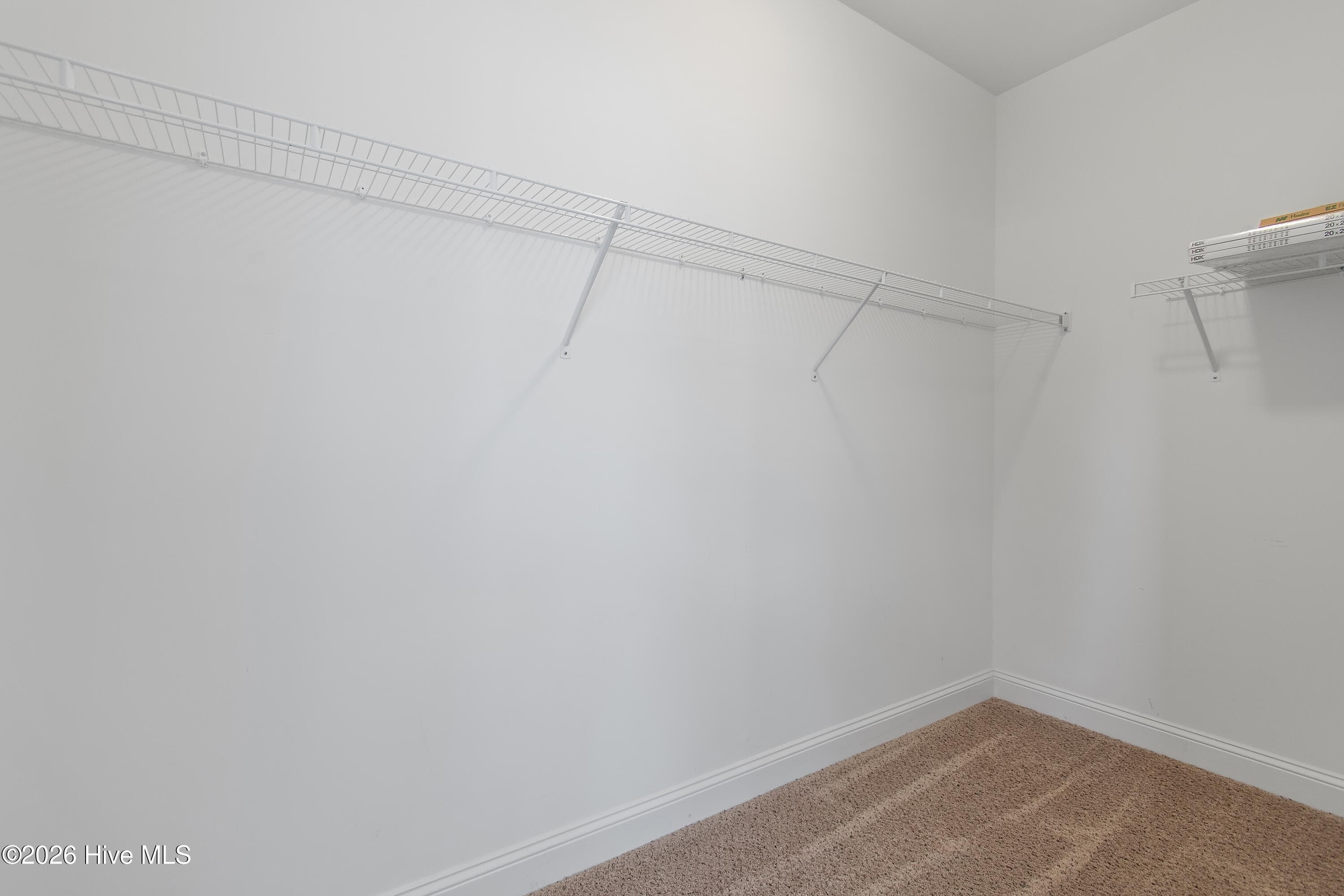 Primary suite walk-in closet #2. - 1674 Back Bay Drive SW, Shallotte, NC 28470