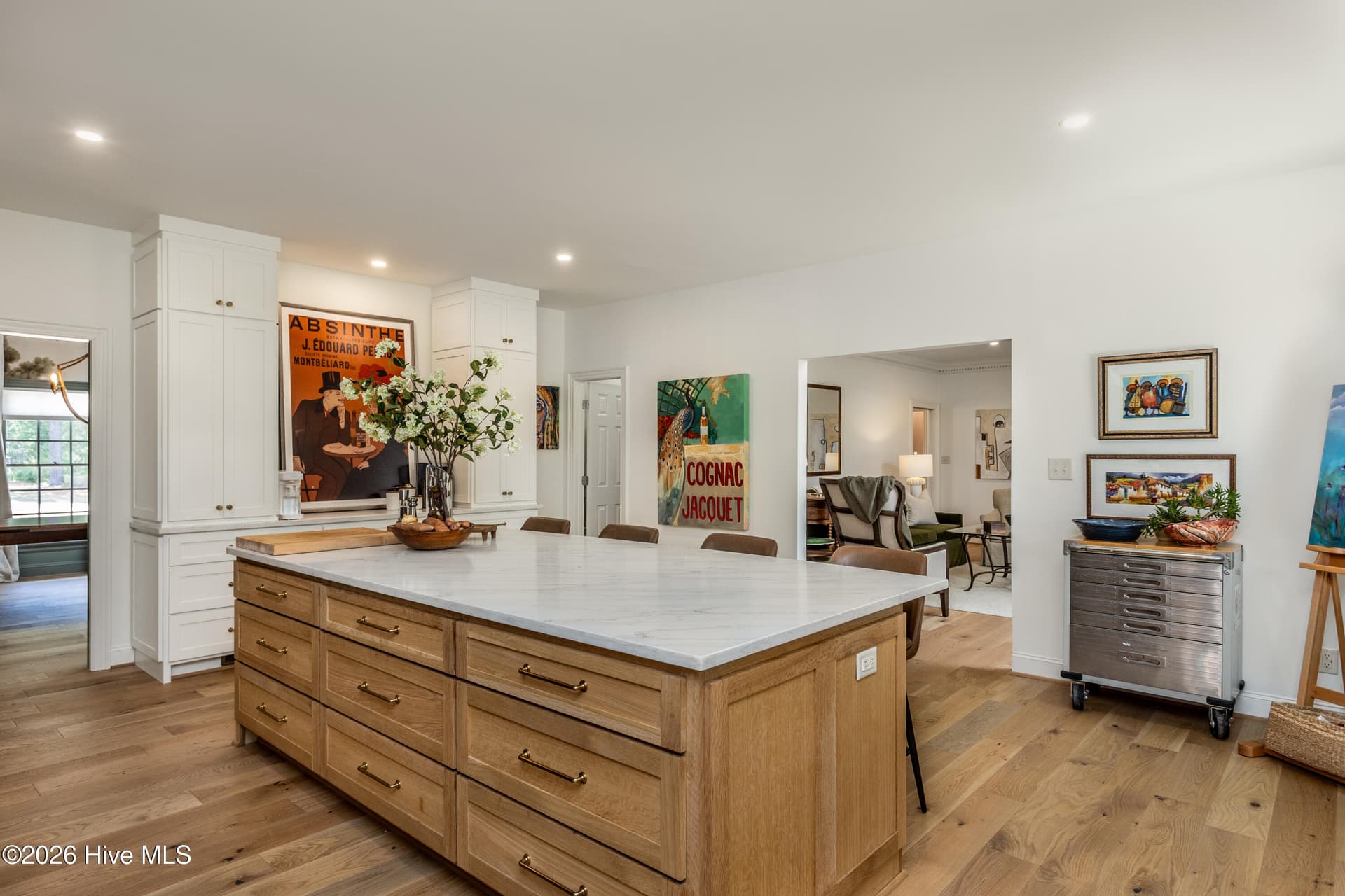 Look at that gorgeous custom white oak island and the engineered wood white oak floors throughout the home! - 5050 Country Club Drive N, Wilson, NC 27896