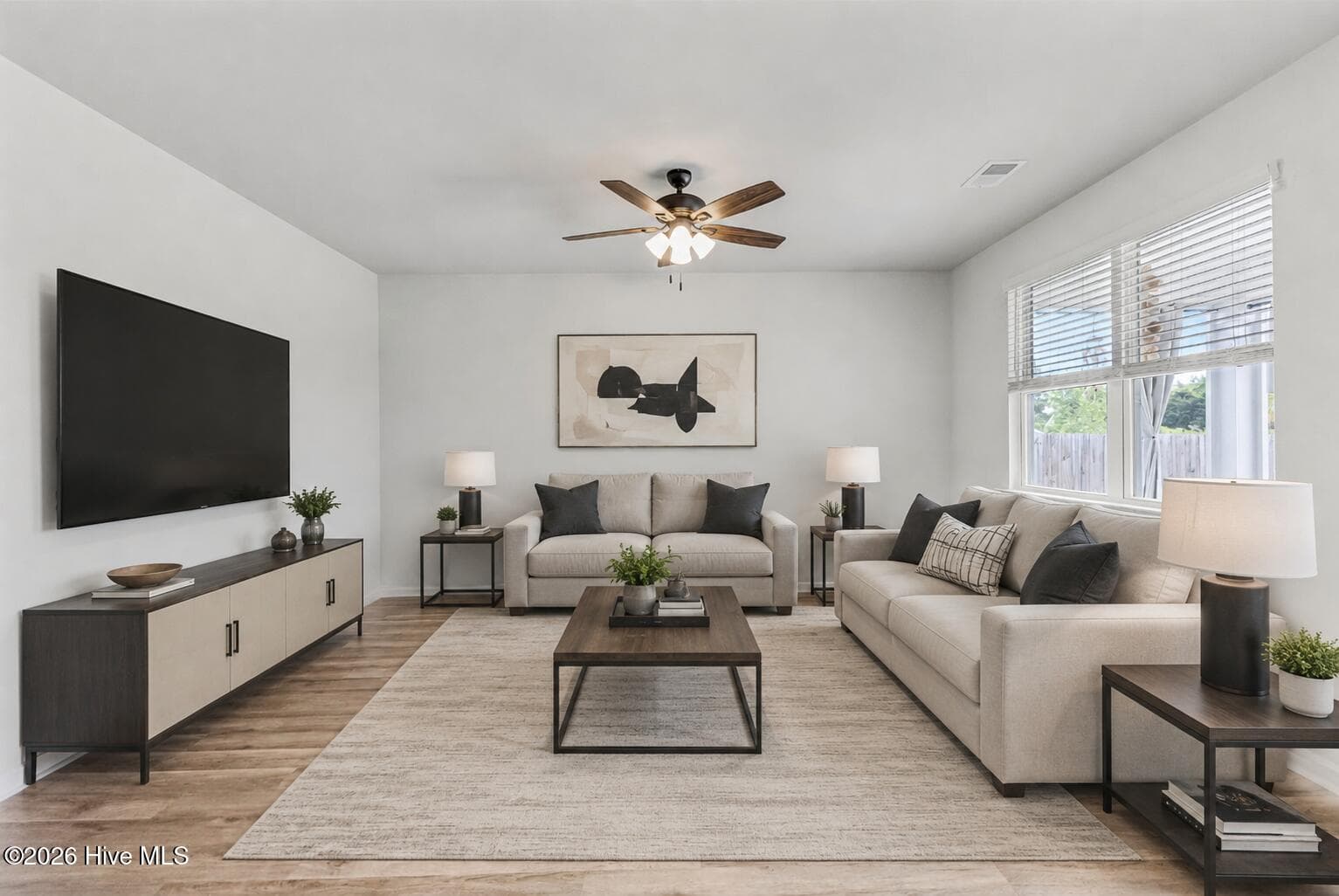 Virtually staged living room. - 1038 Burled Oak Ridge Loop SE, Bolivia, NC 28422