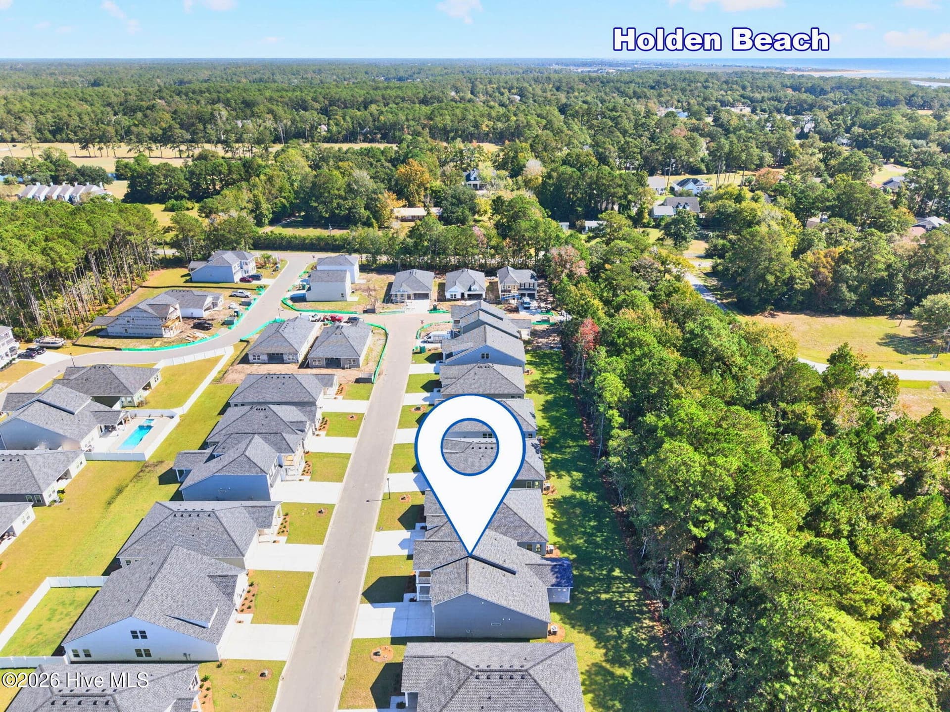 Wood Stork Landing neighborhood setting with surrounding greenery and convenient access to coastal attractions. - 3447 Sandhill Crane Drive SW, Ocean Isle Beach, NC 28469