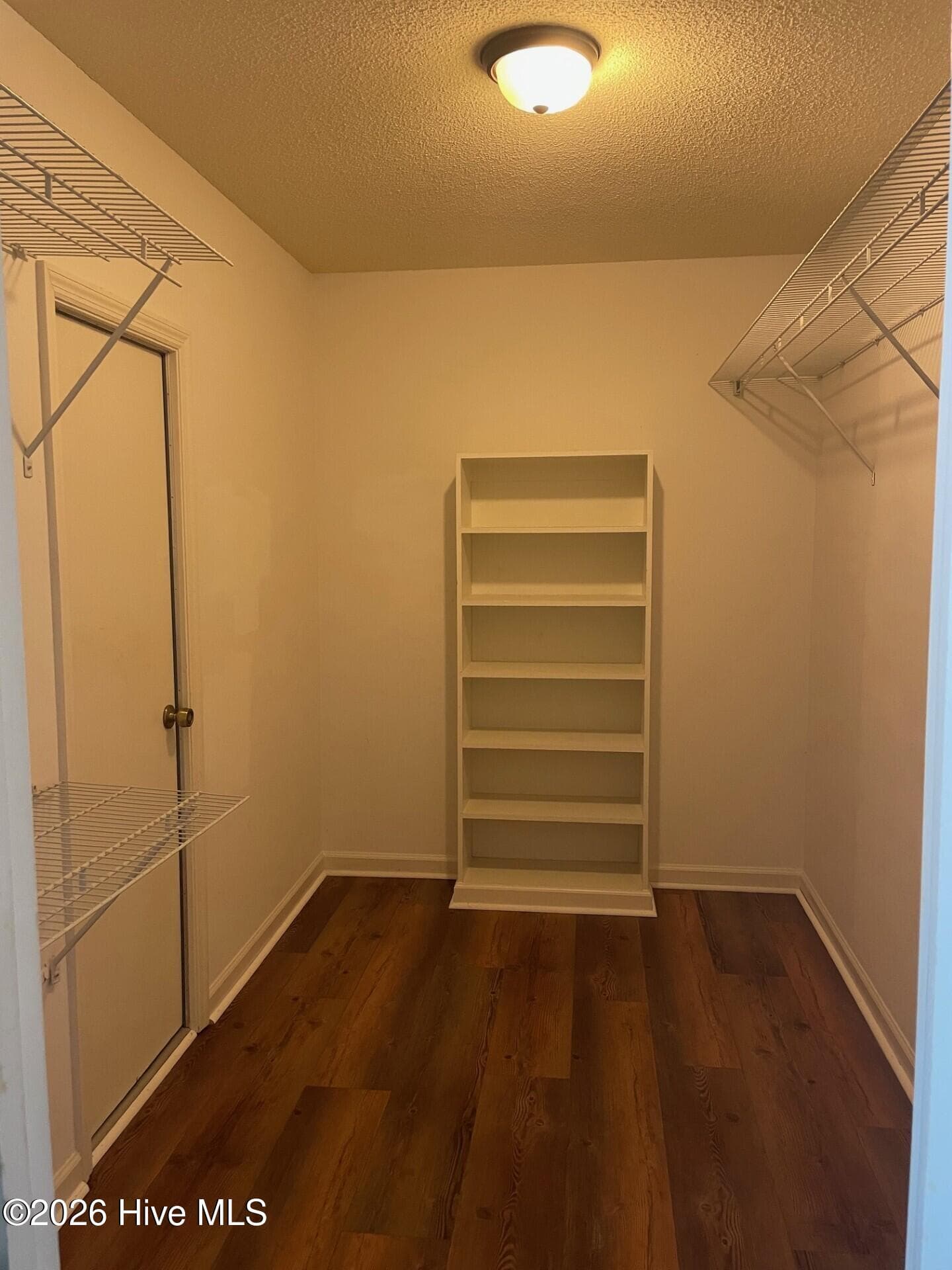 Walk in closet with built-ins and attic storage area. - 4164 Quail Springs Circle, Augusta, GA 30907